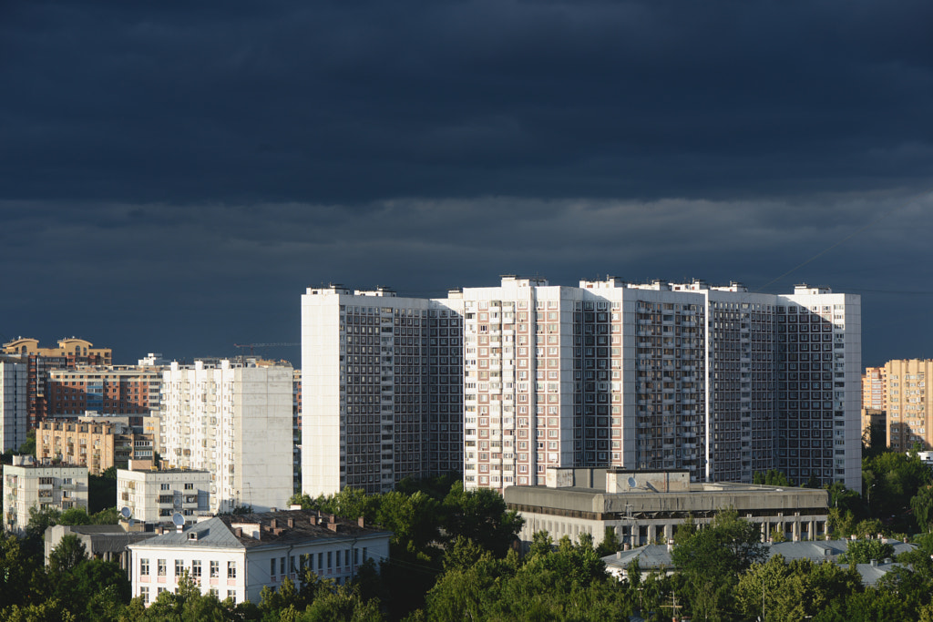 City buildings, dark clouds sky, light and shadow by Anastasia A on 500px.com