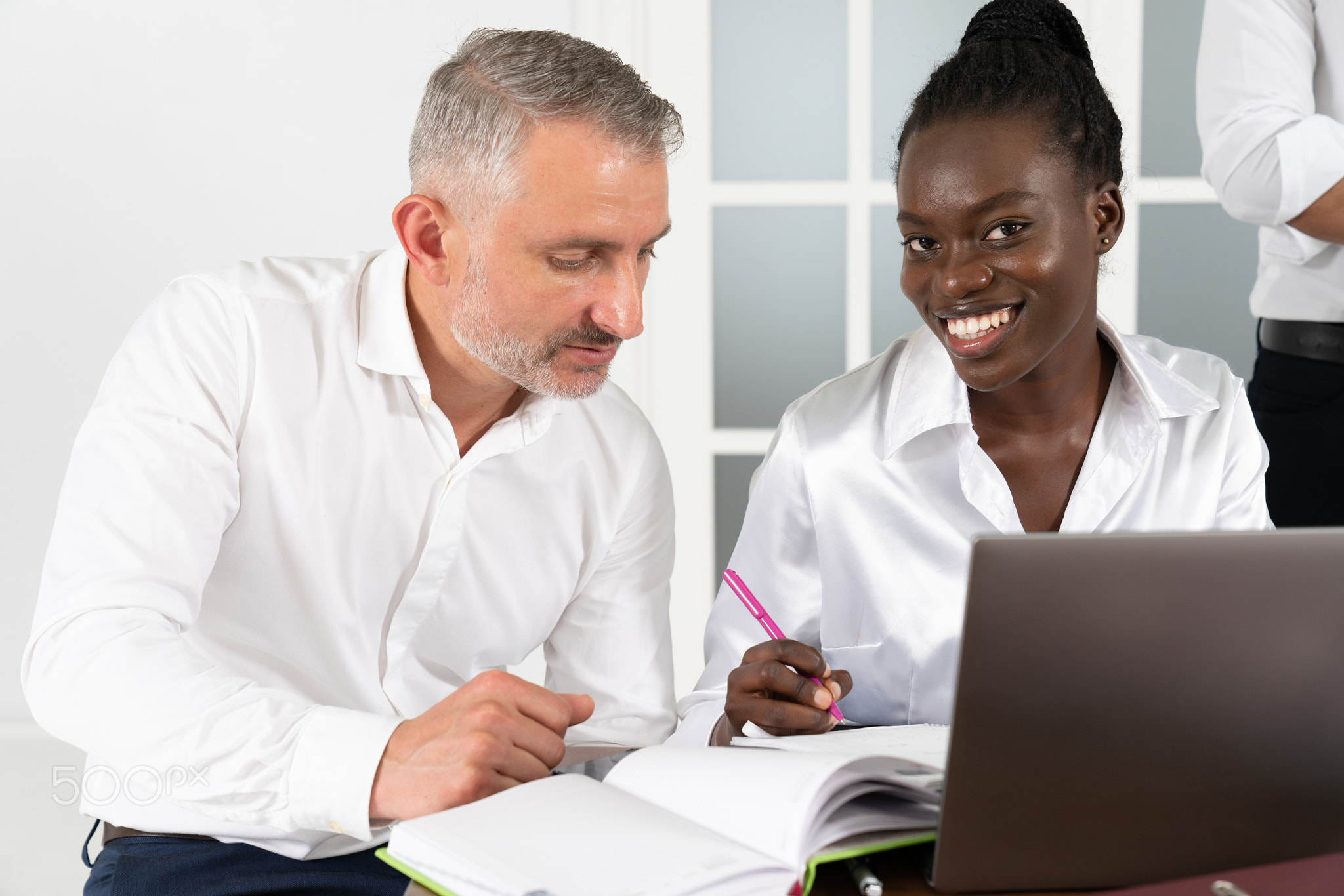 African American businesswoman consulting client about loan or