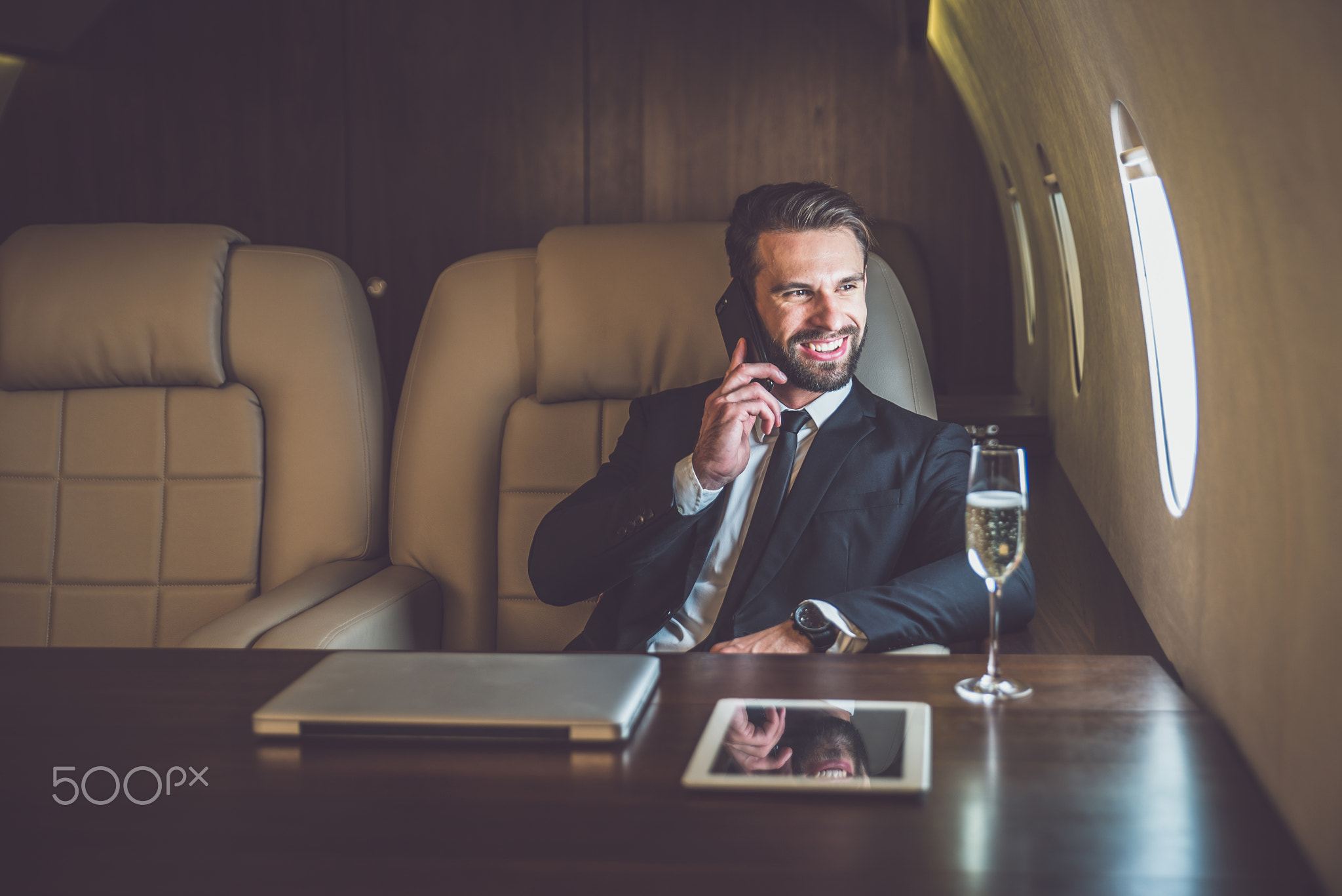 Businessman flying on his private jet