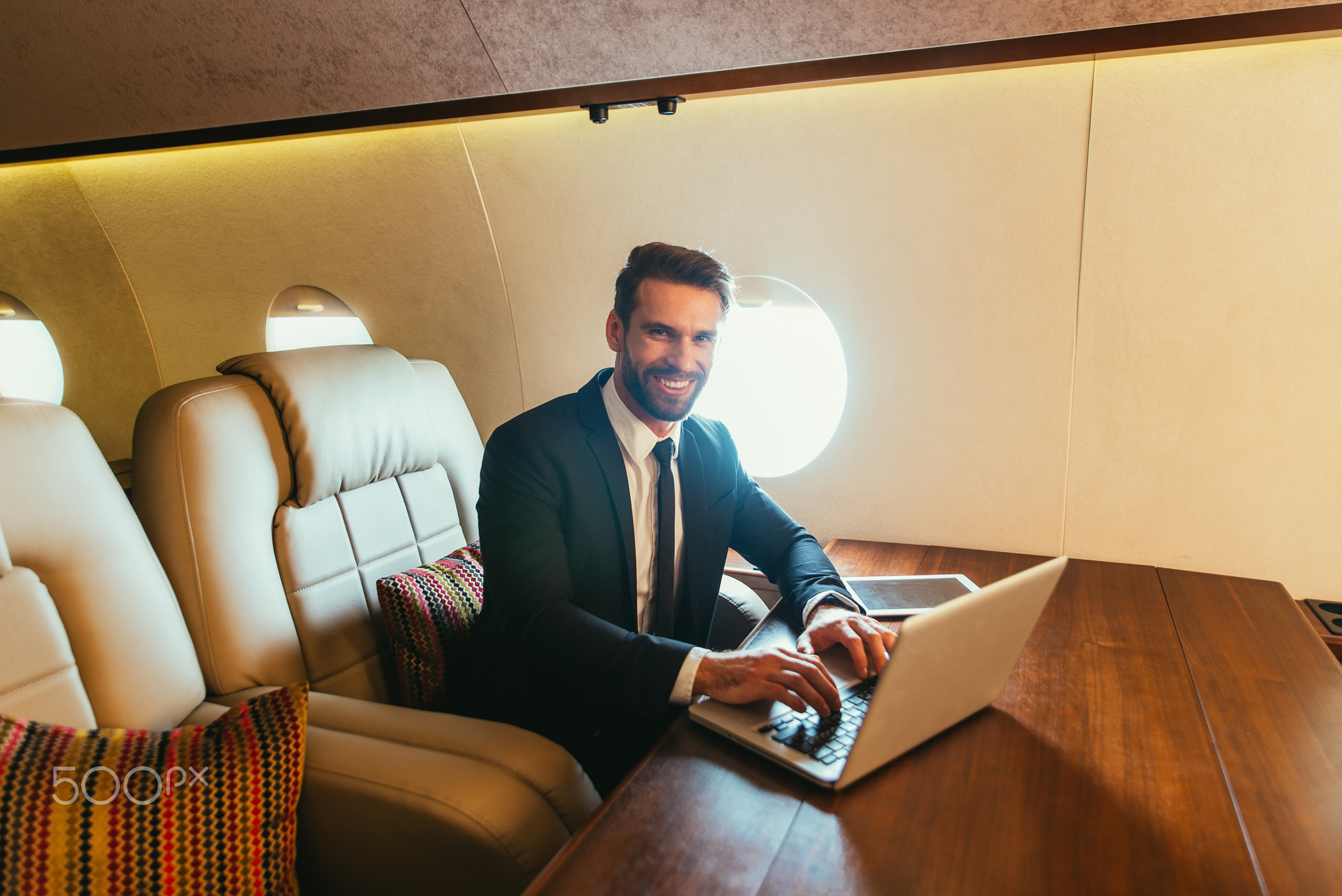 Businessman flying on his private jet