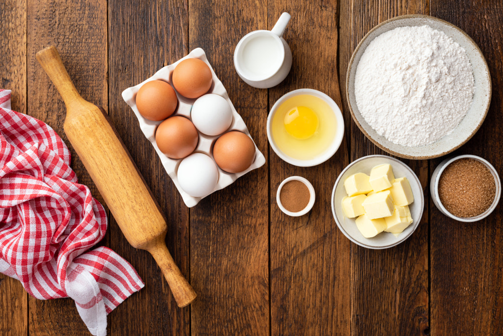 Baking ingredients on a wooden table by Vladislav Nosick on 500px.com