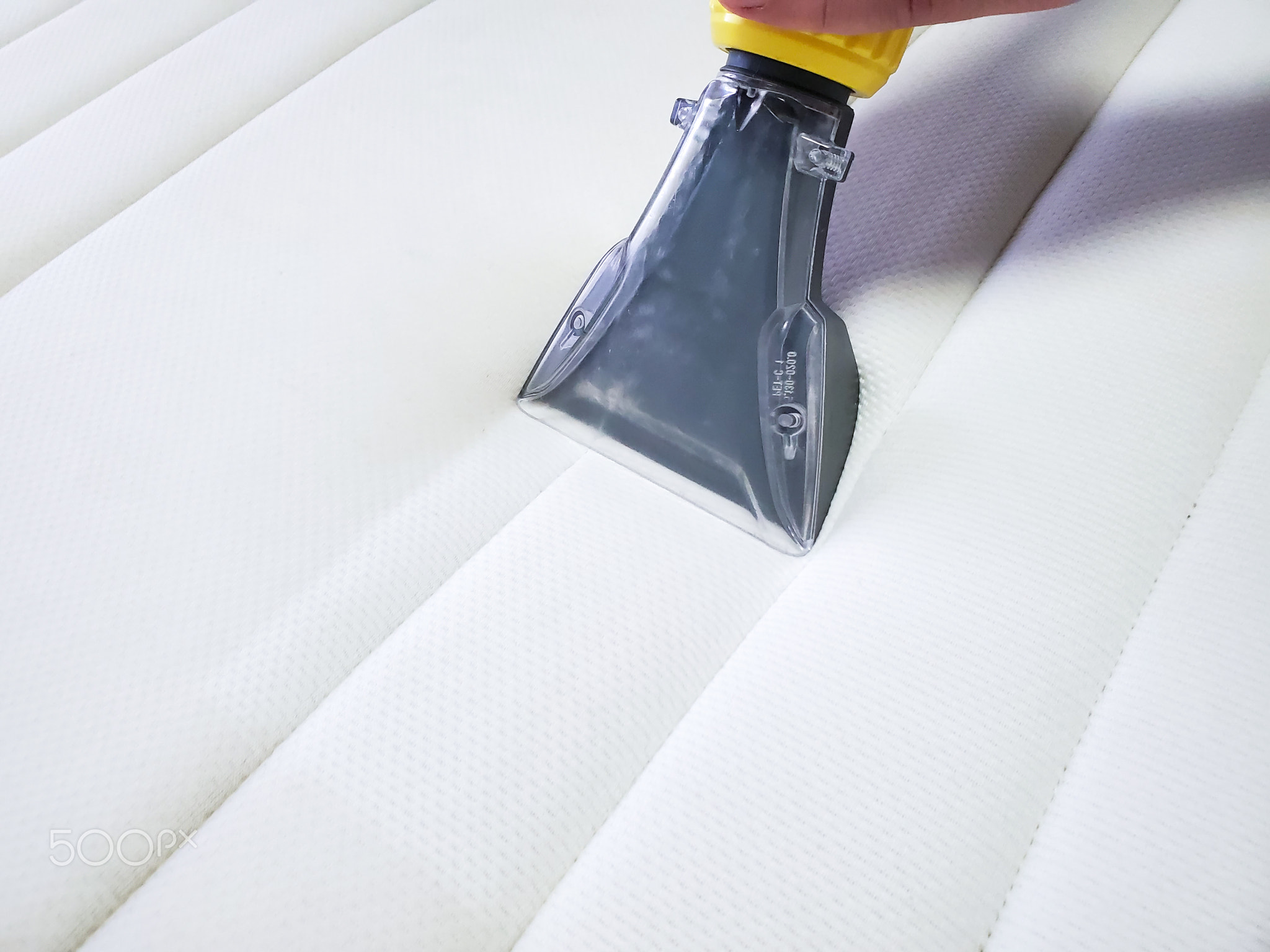 Mattress dry cleaning with professional extraction method. Close up