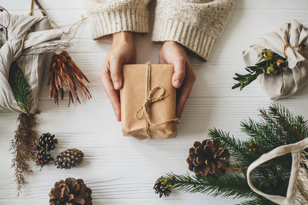 Hands holding stylish simple christmas gift  by Bogdan Sonjachnyj on 500px.com