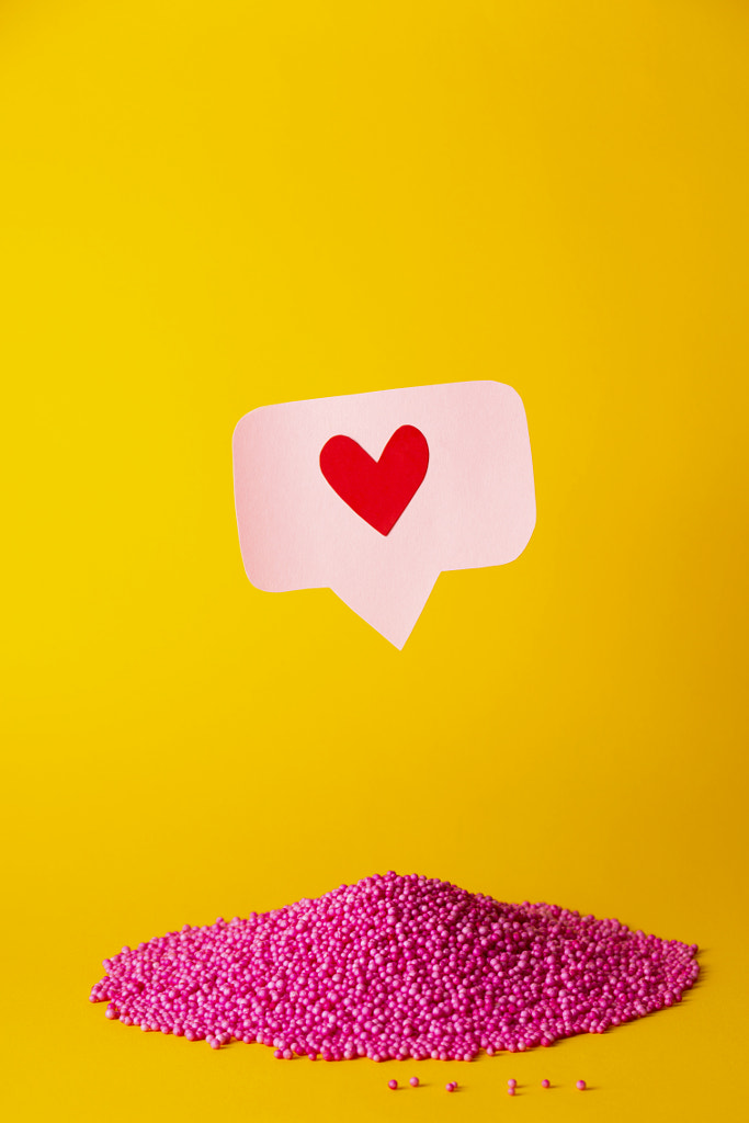 Social media promotion success concept. Pink heart-shaped emoji by Valeriia Sviridova on 500px.com