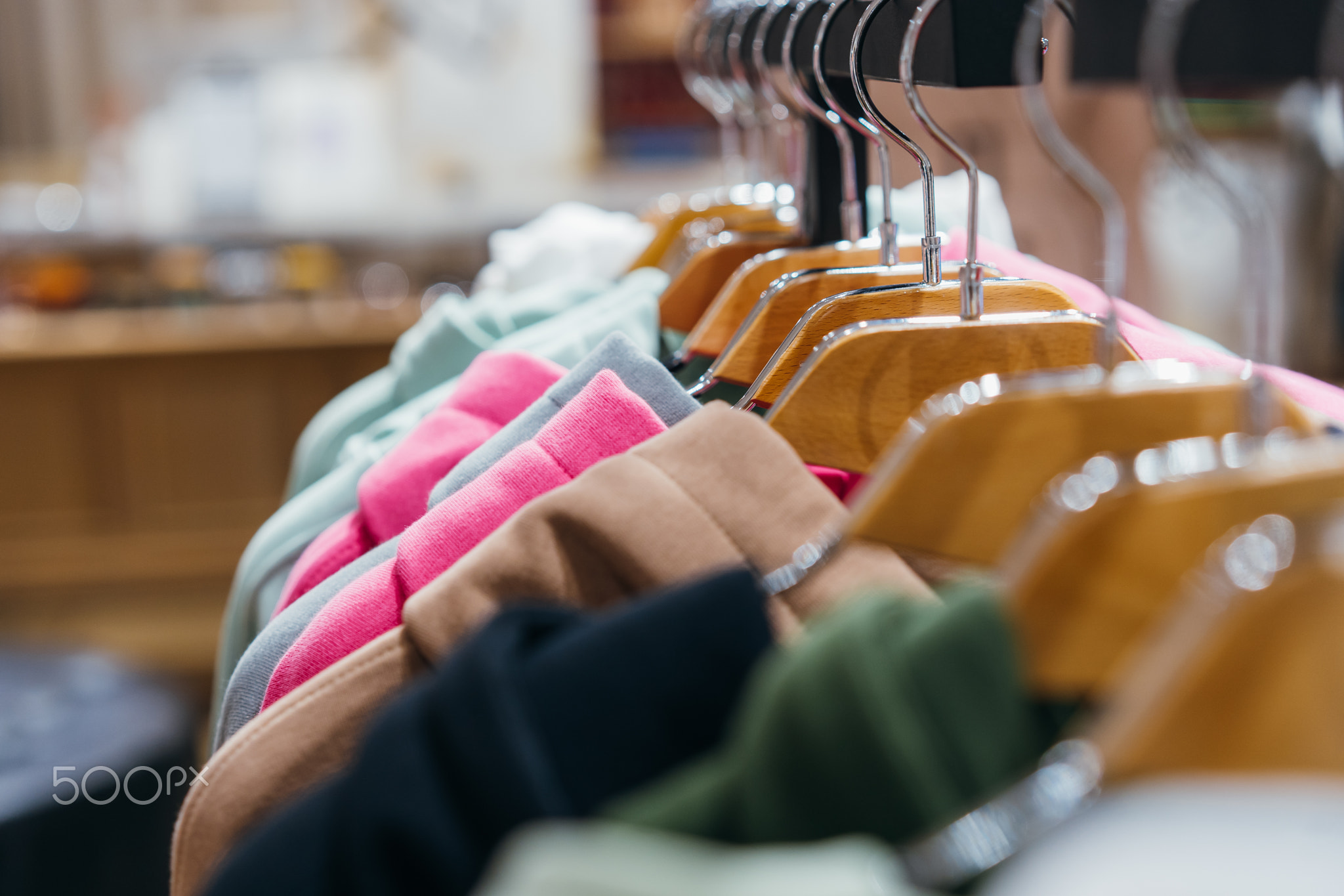 fashion clothing on hangers at the show