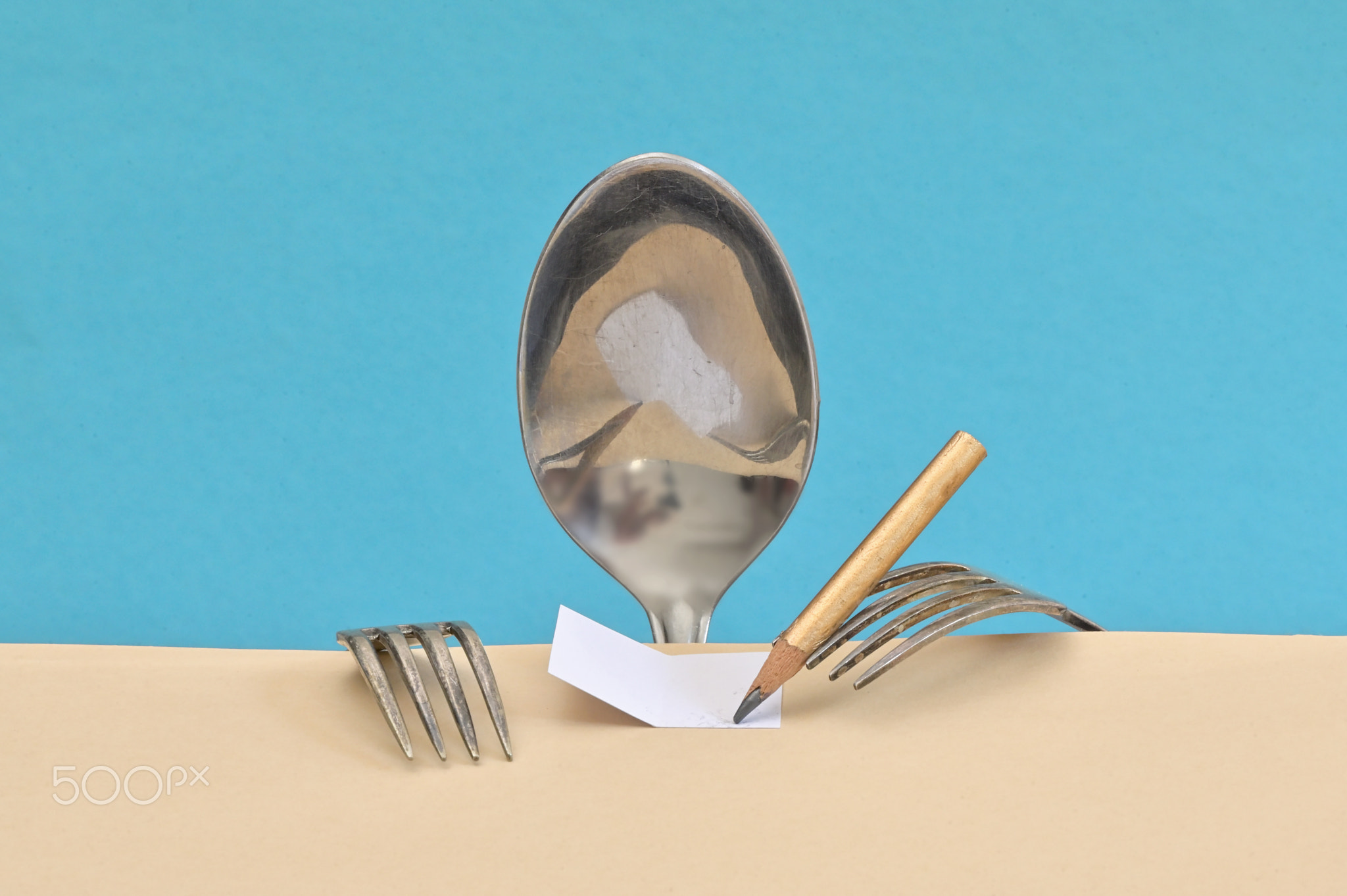 Child from spoon and forks doing homework