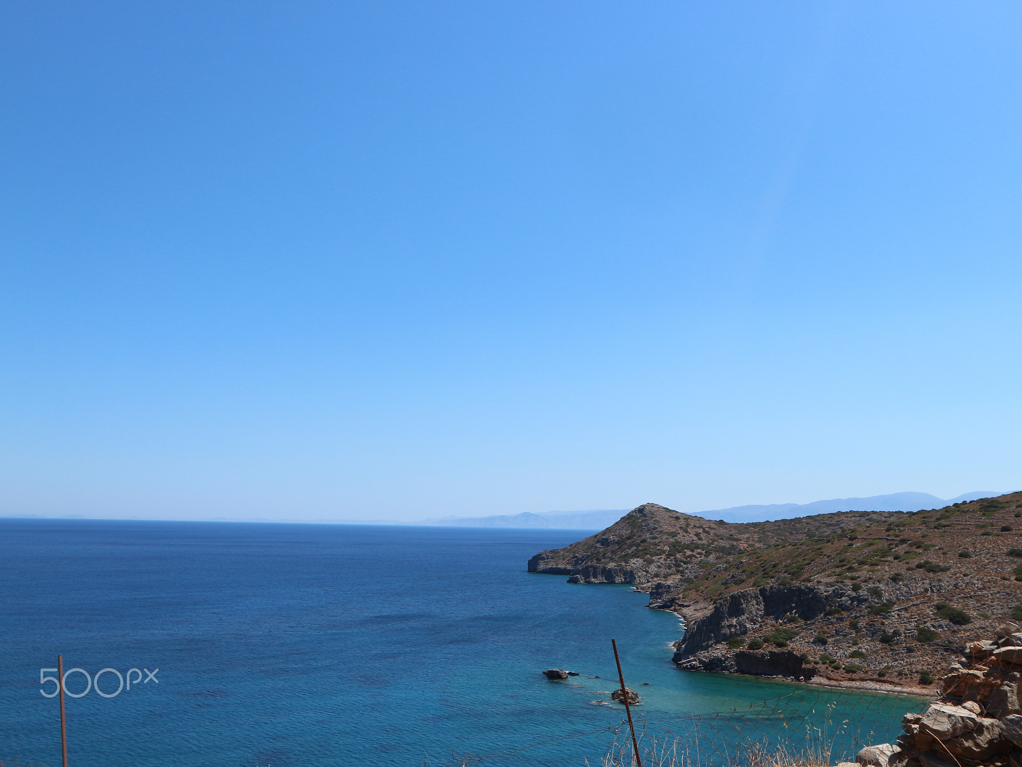 Dark Blue Ocean with Small Mountain on the Right Hand Side