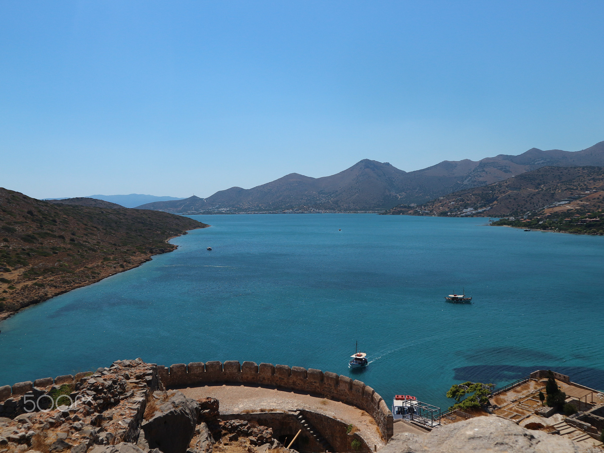 Ocean View from Spinalonga Island with Old Tower Walls and Blue Ocean