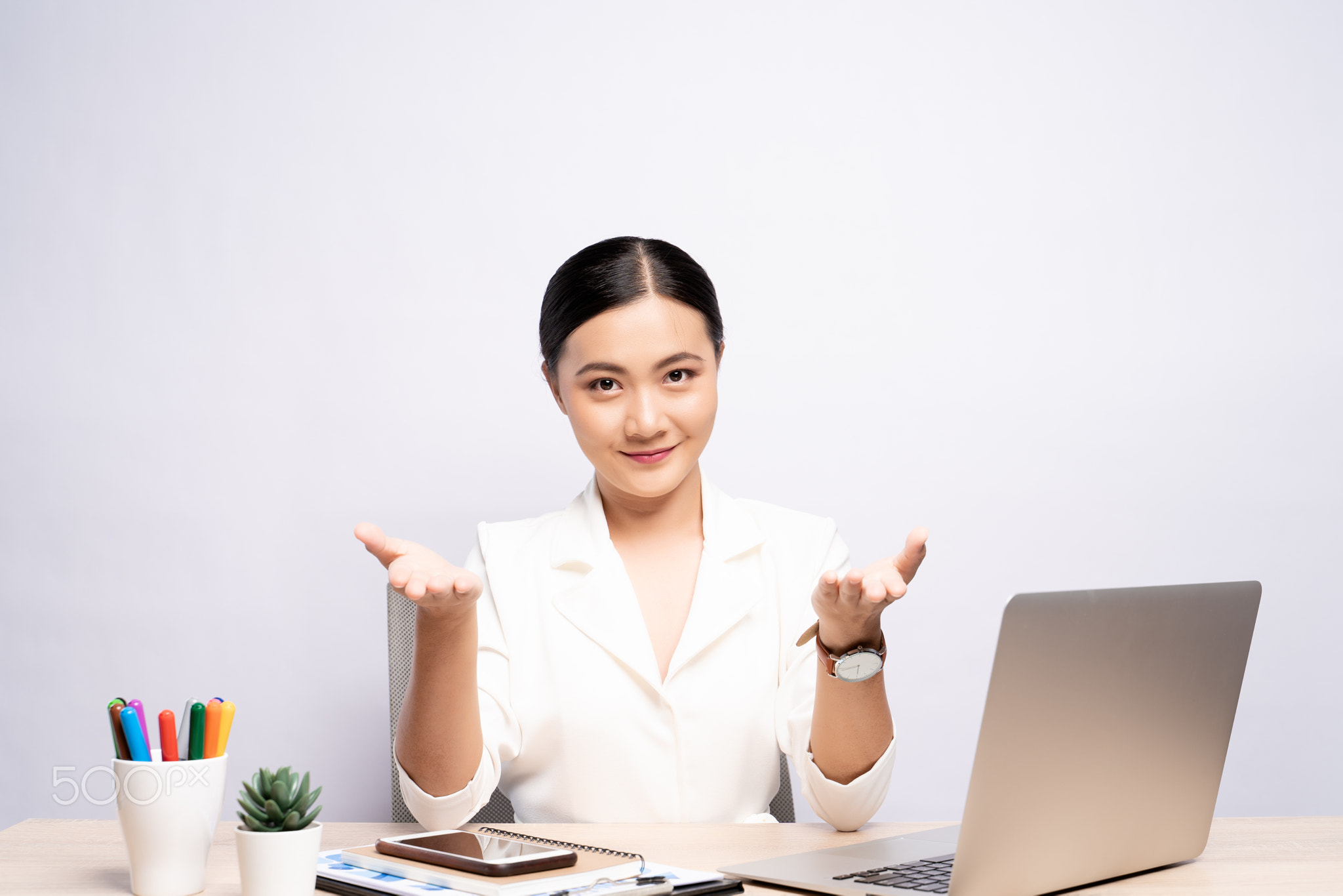 Portrait of a woman has positive thinking sitting at office isolated