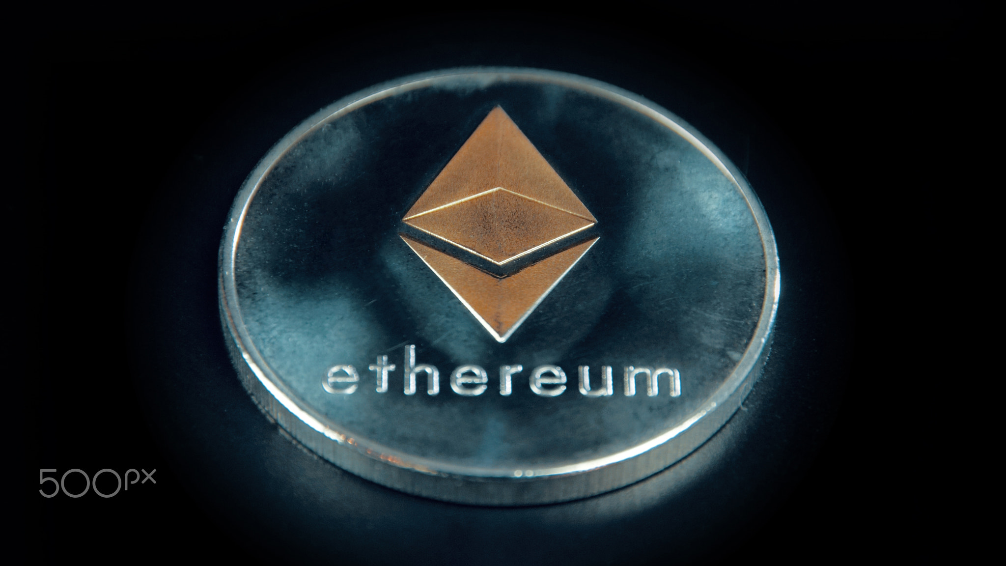 SIlver Ethereum coin on black background. Silver Crypto coin on