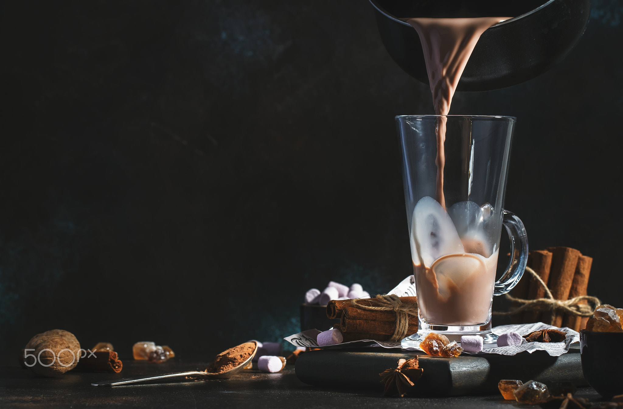 Pouring winter hot chocolate cocoa