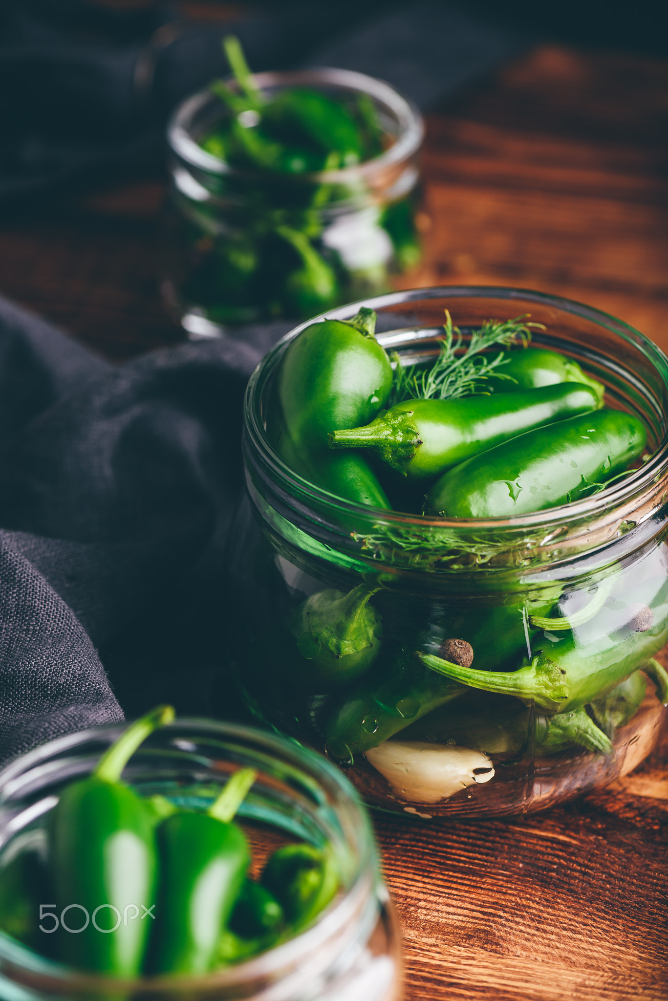 Canned Jalapeno Peppers, Garlic And Dill in Glass Jars