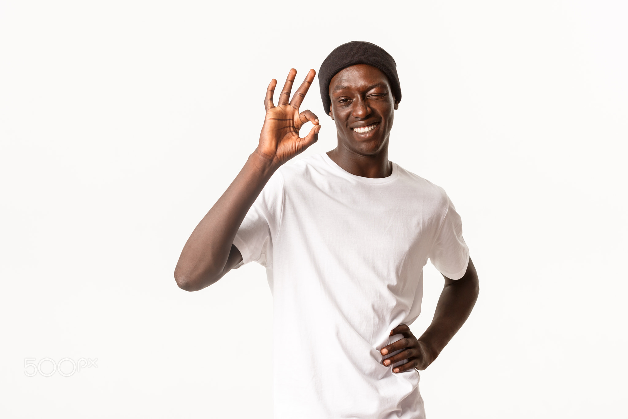 Portrait of confident and upbeat african-american cool guy in beanie