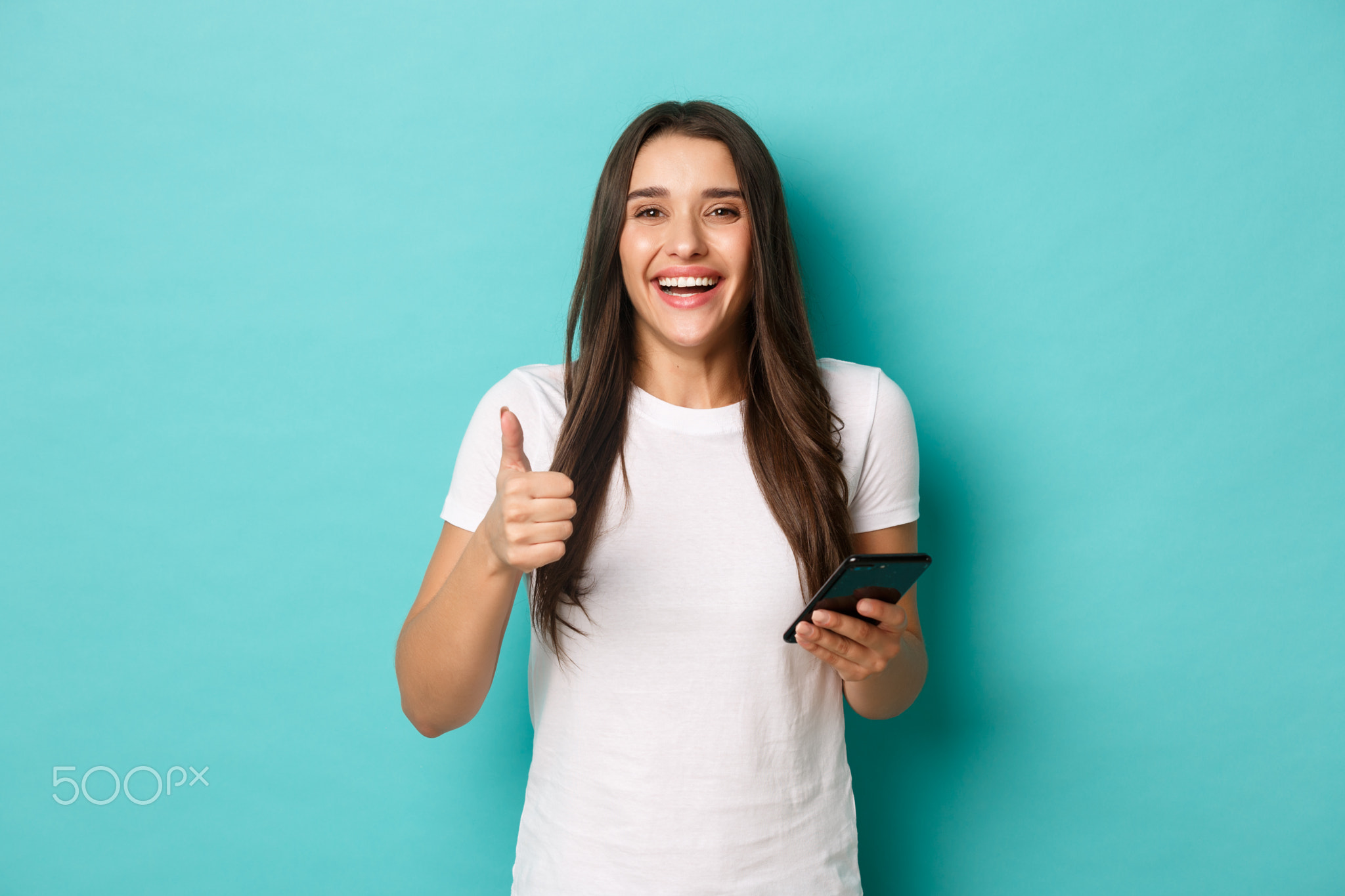 Portrait of happy and satisfied modern girl, wearing white casual t