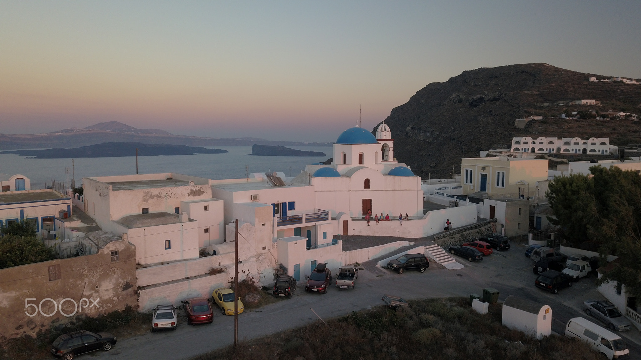 Aerial view flying small town on Santorini Greece