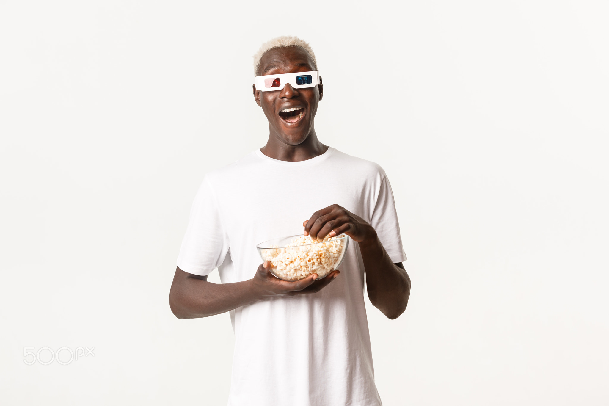 Portrait of amused carefree african-american guy, wearing 3d glasses