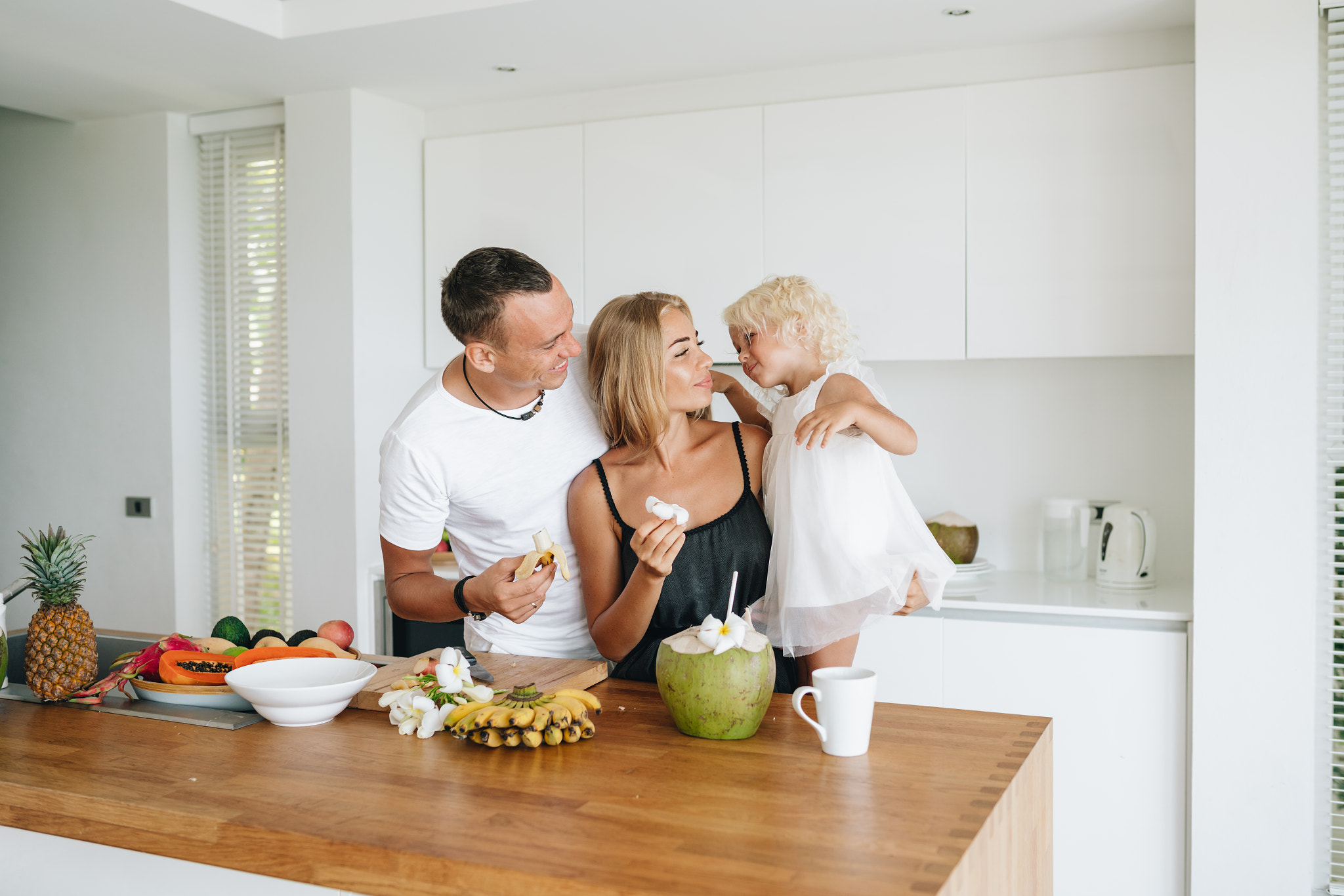 Happy family having breakfast at the kitchen