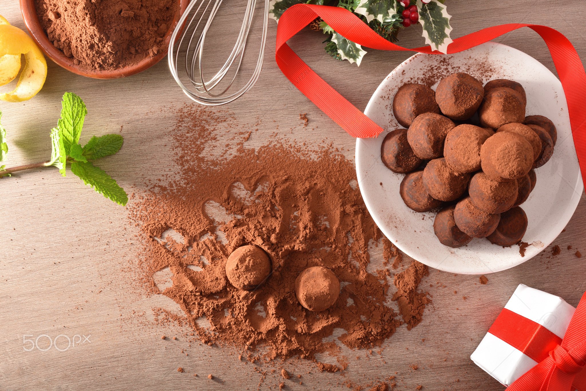 Chocolate truffles with cocoa powder and ingredients for event top