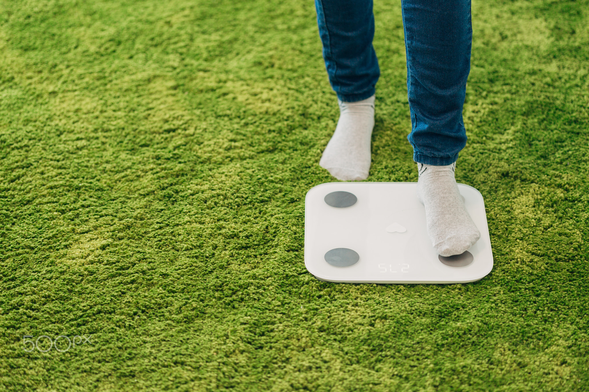 Girl Measures Weight During Diet. Smart Scales for Home.