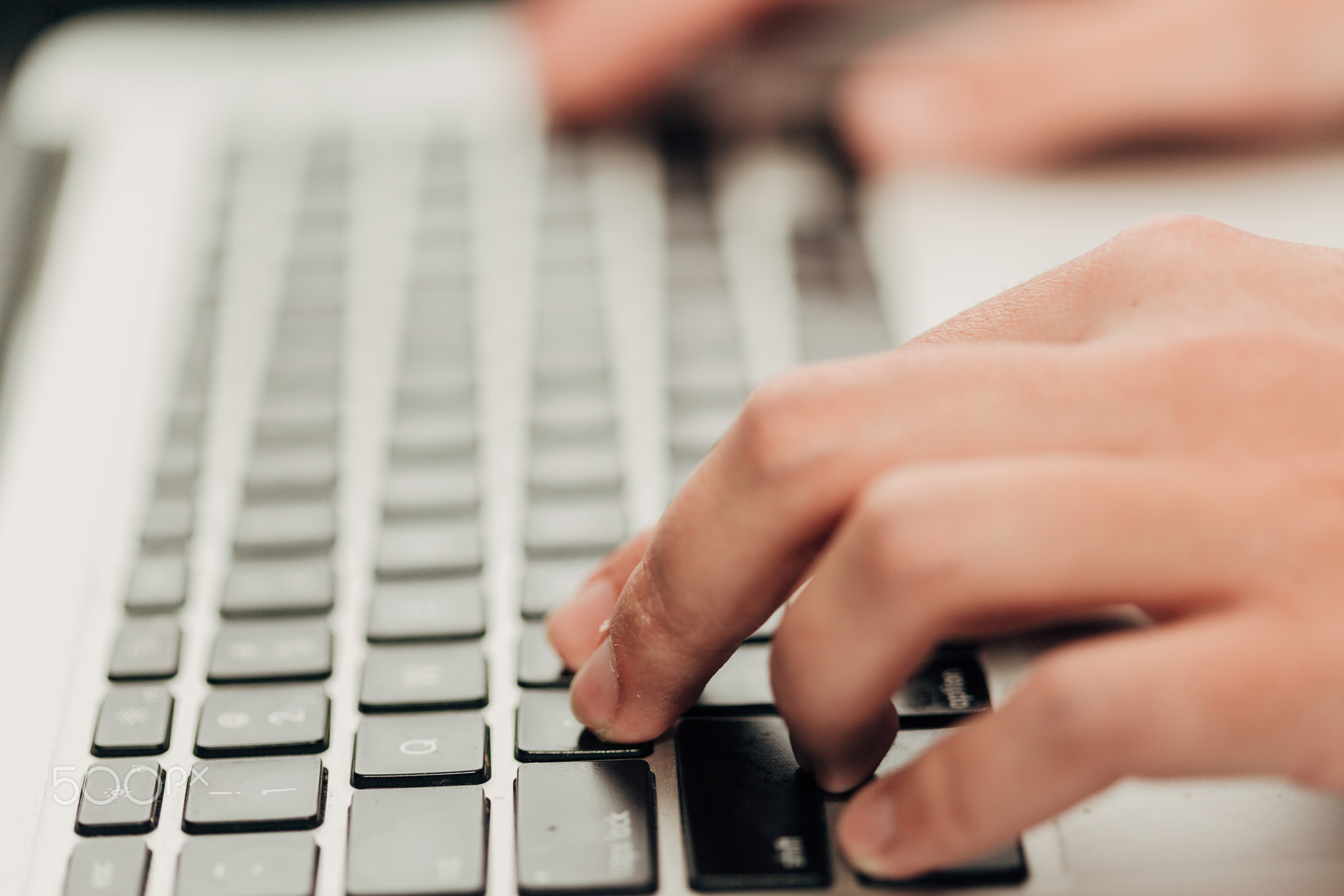 Close-Up Shot of Human Hands Placed Over Laptop