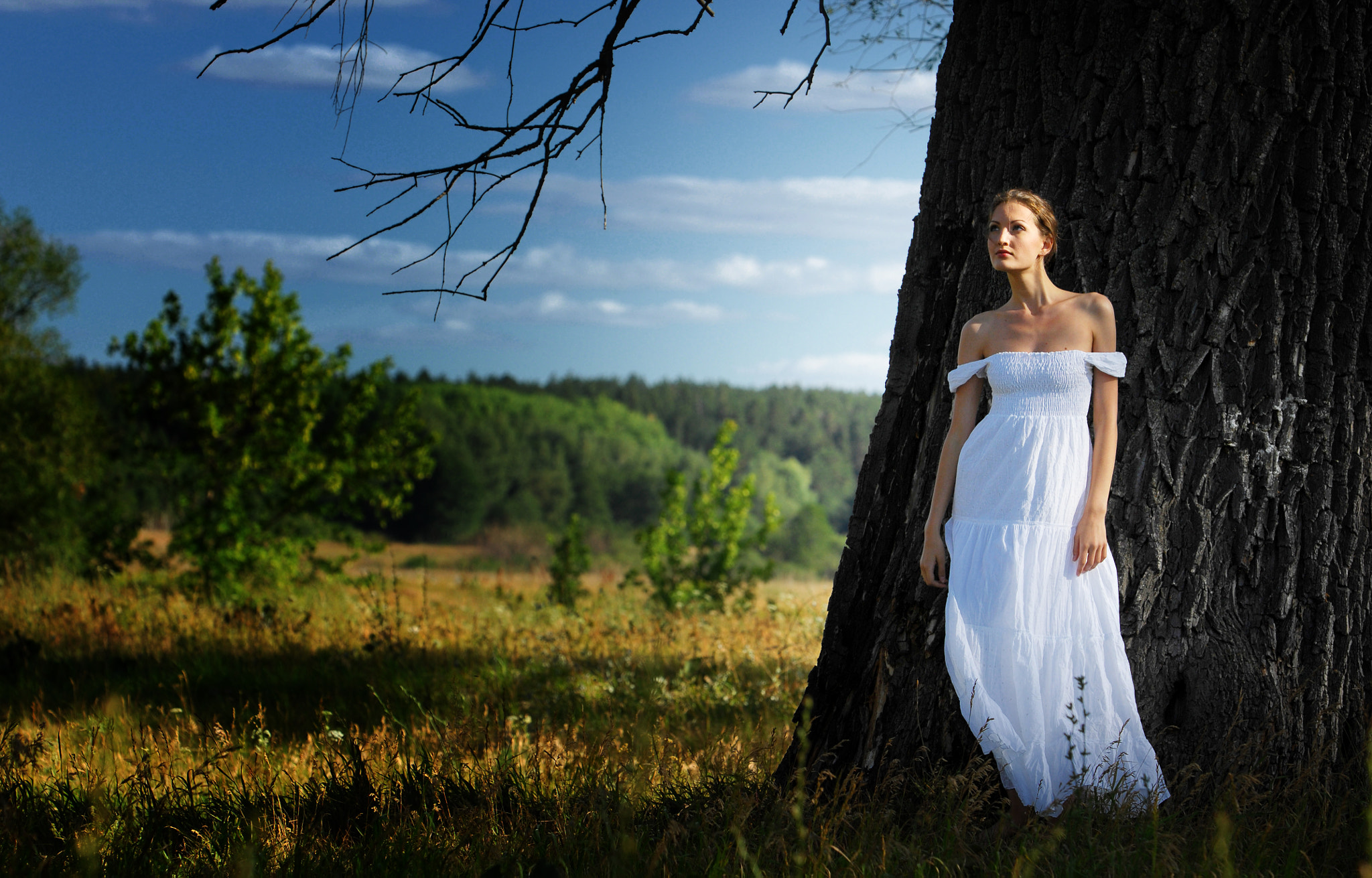 Girl under the open sky, Model in a white summer dress.