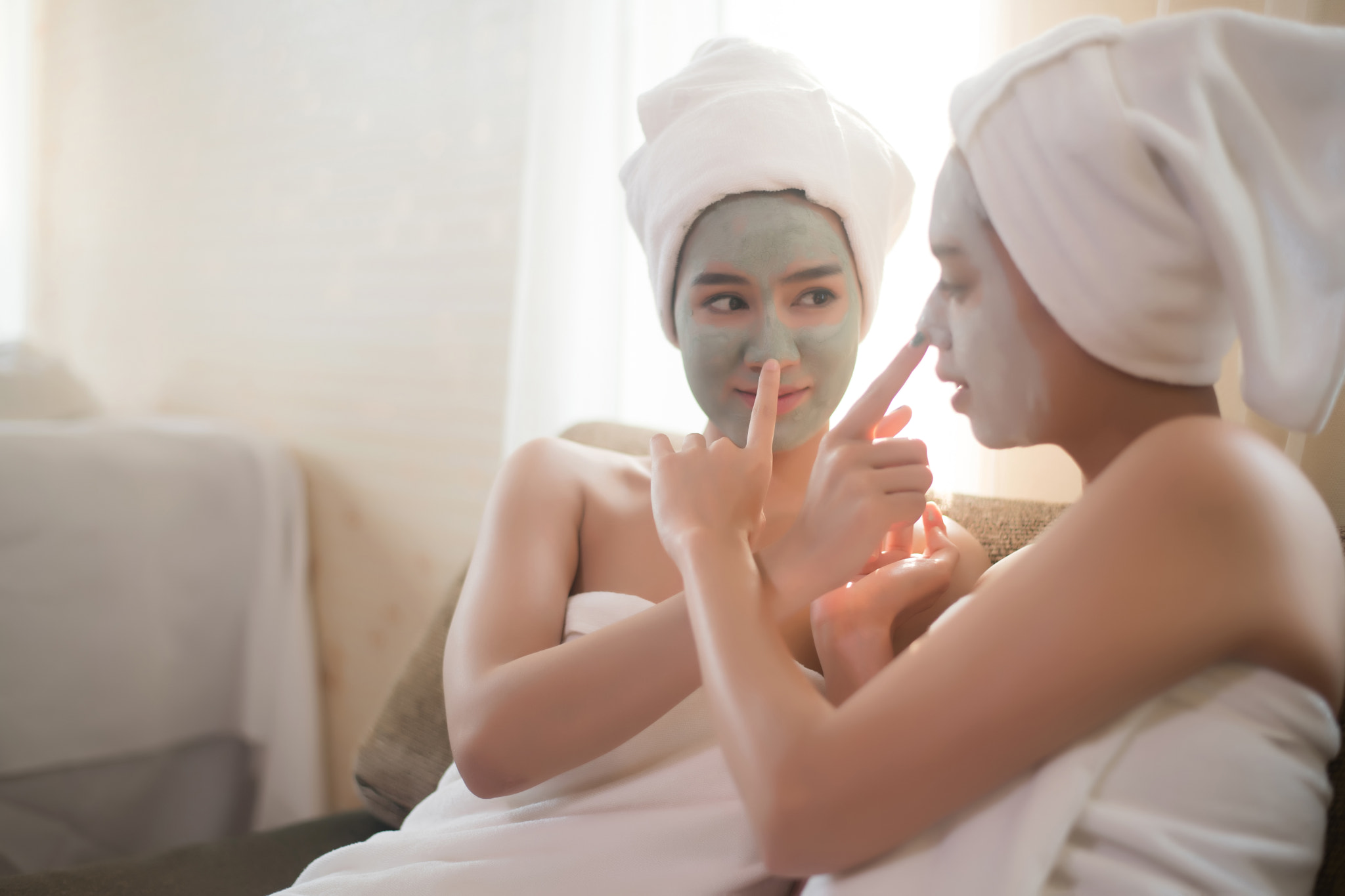 Beautiful woman lying on spa mask face with treatment spa.
