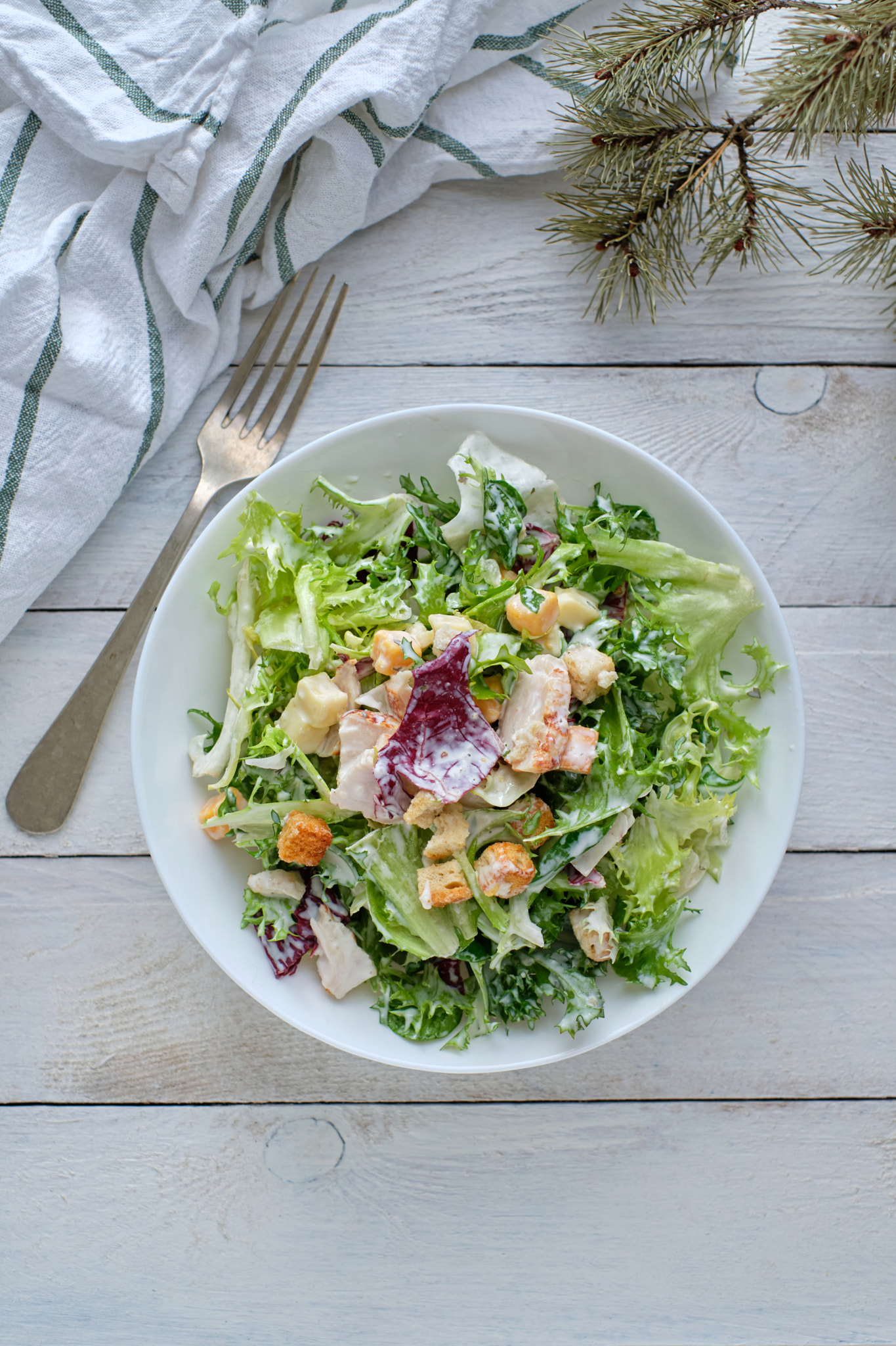 Cesar salad on rustic table