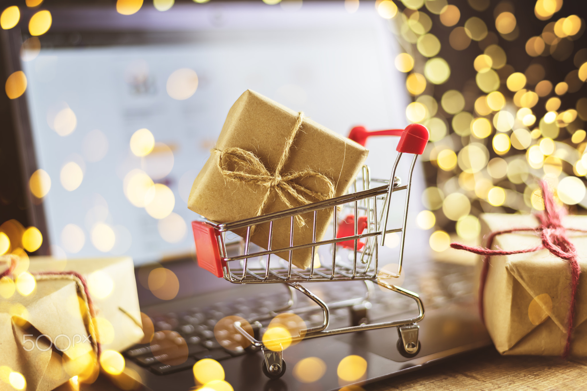 concept of online shopping. new year, christmas, trolley, gifts