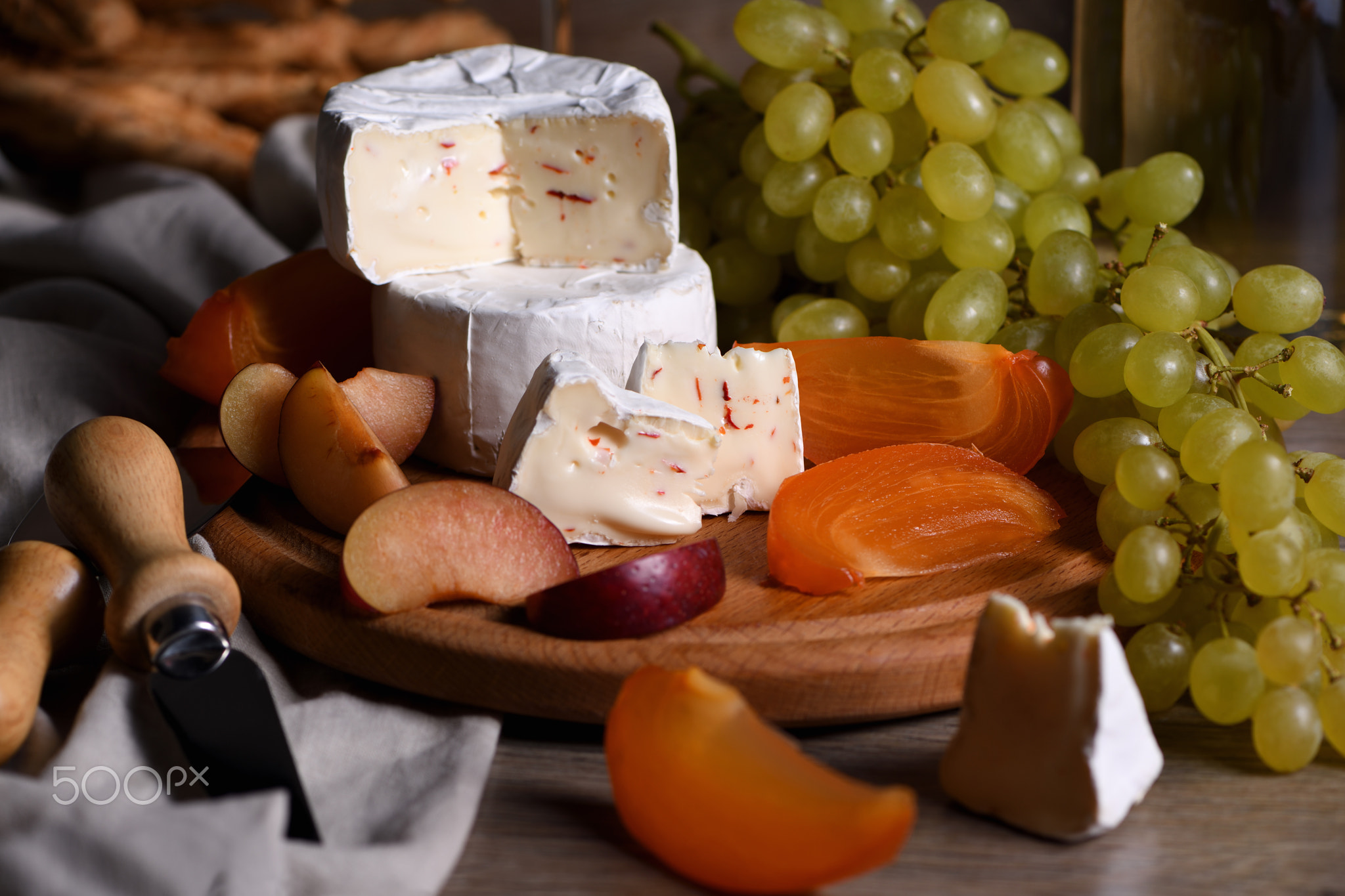 Cheese camembert with fruit and wine