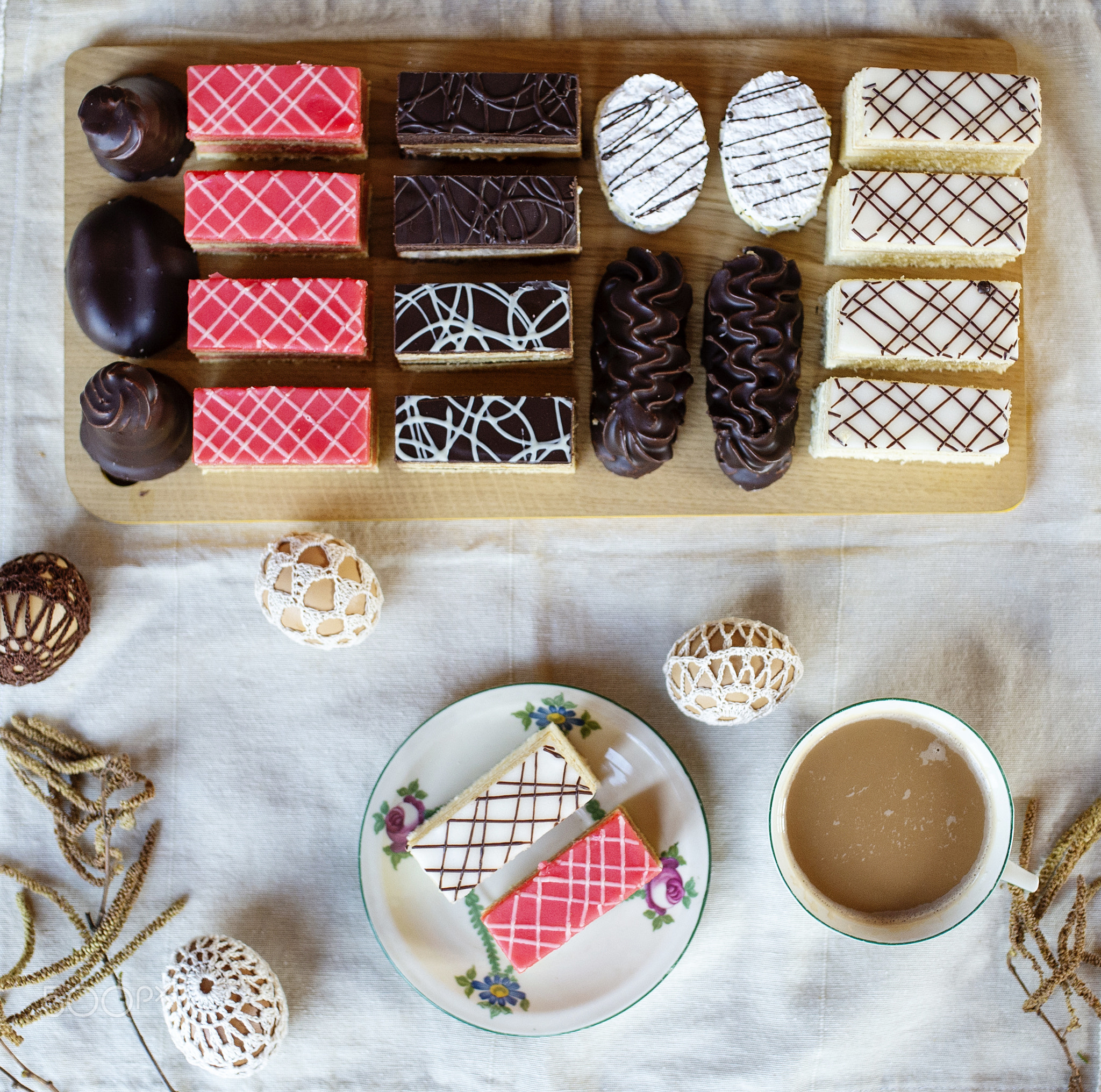 Top view of selection of colorful and delicious cake desserts on tray