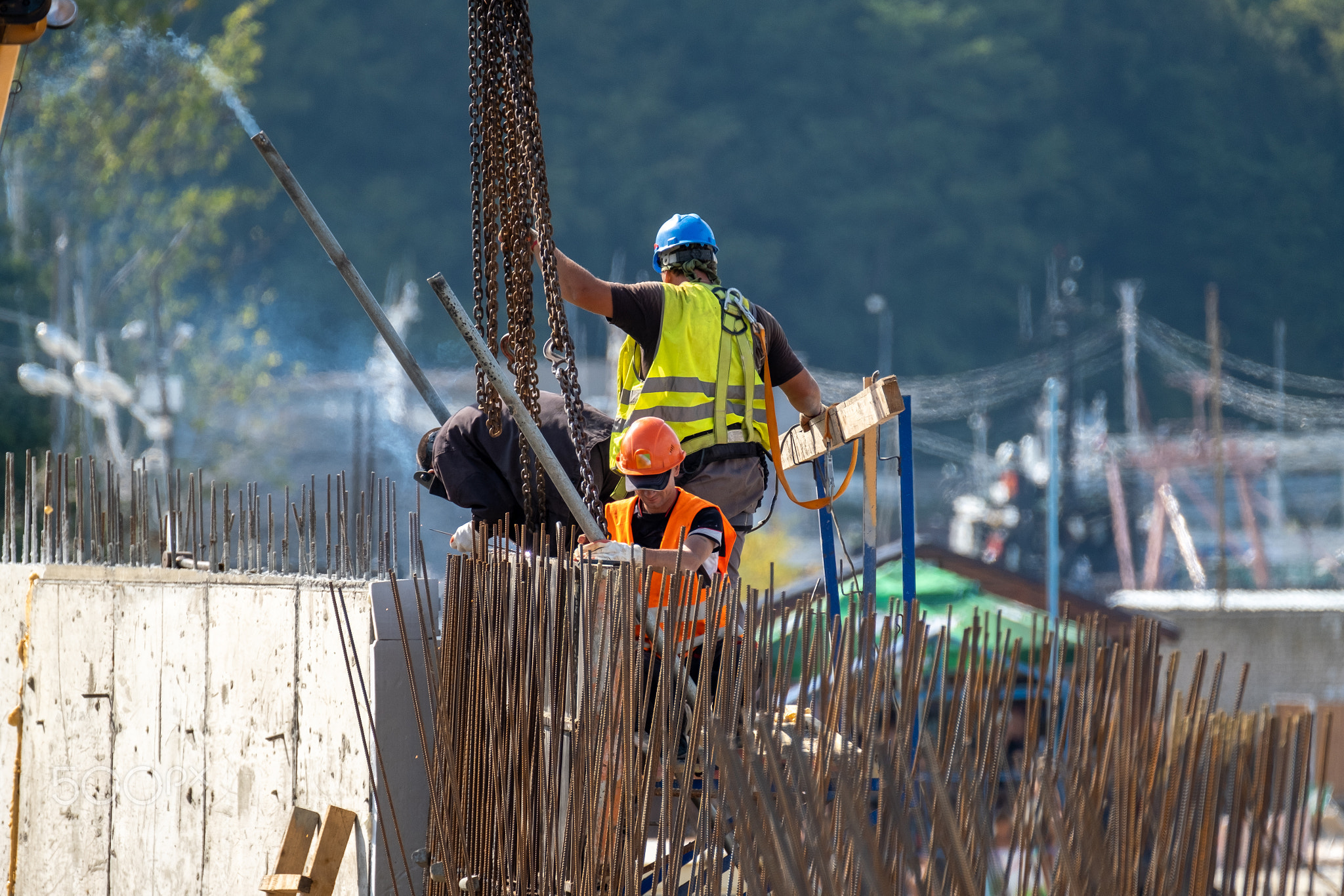 Unrecognizable builders working in port