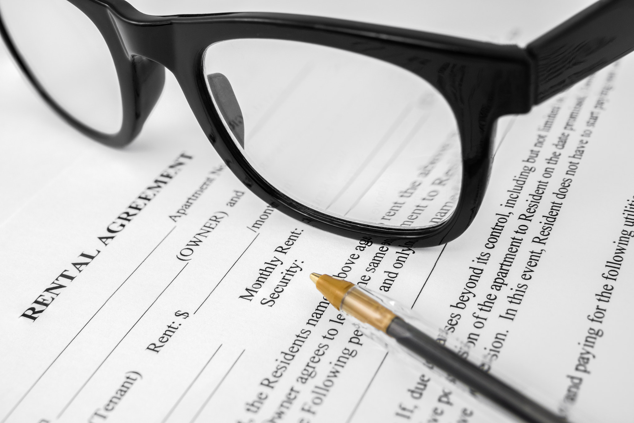 Detail Of A Rental Agreement: Detail Of A Rental Agreement For An Apartment Or Home Being Signed, Including Monthly Rent And Security Deposit
