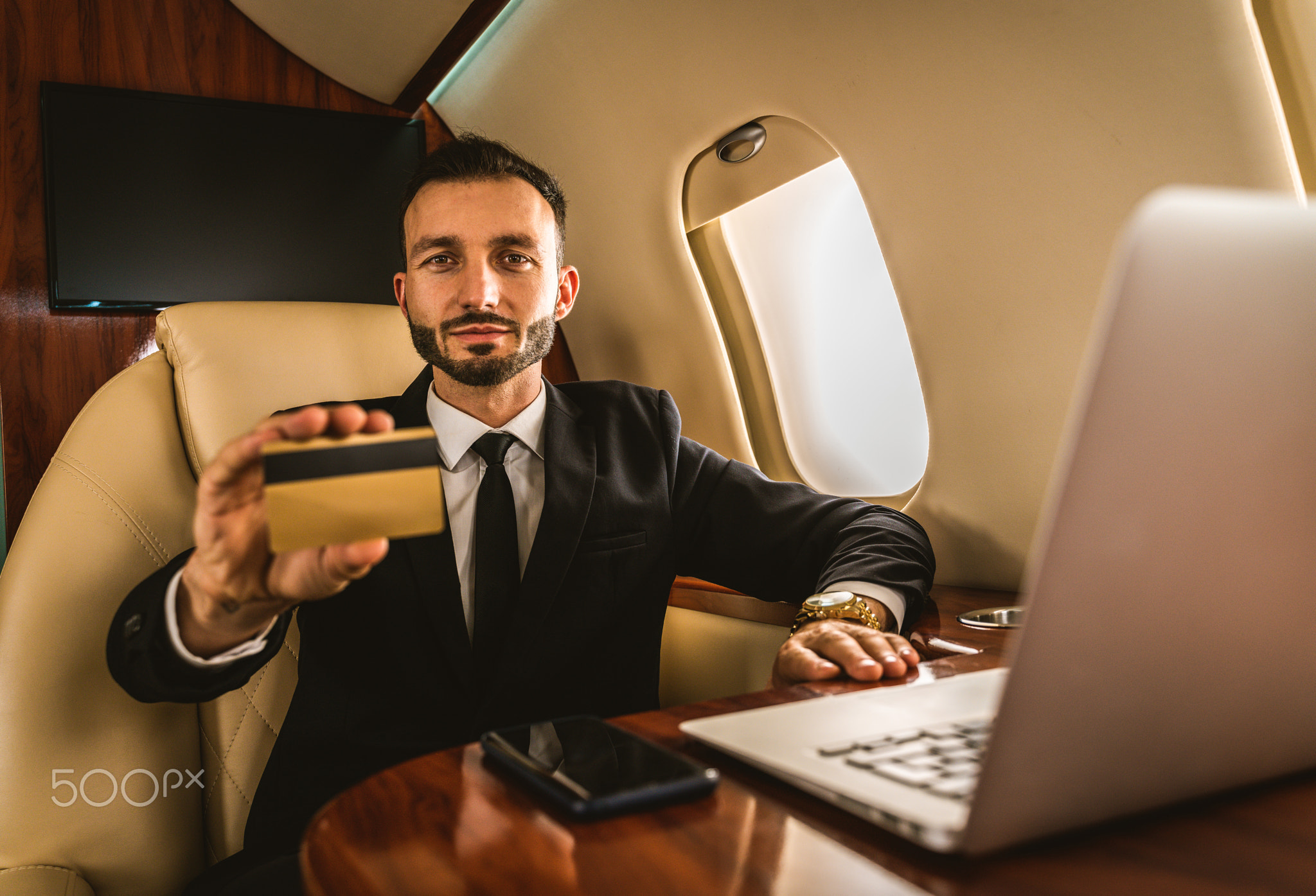Businessman flying on private jet