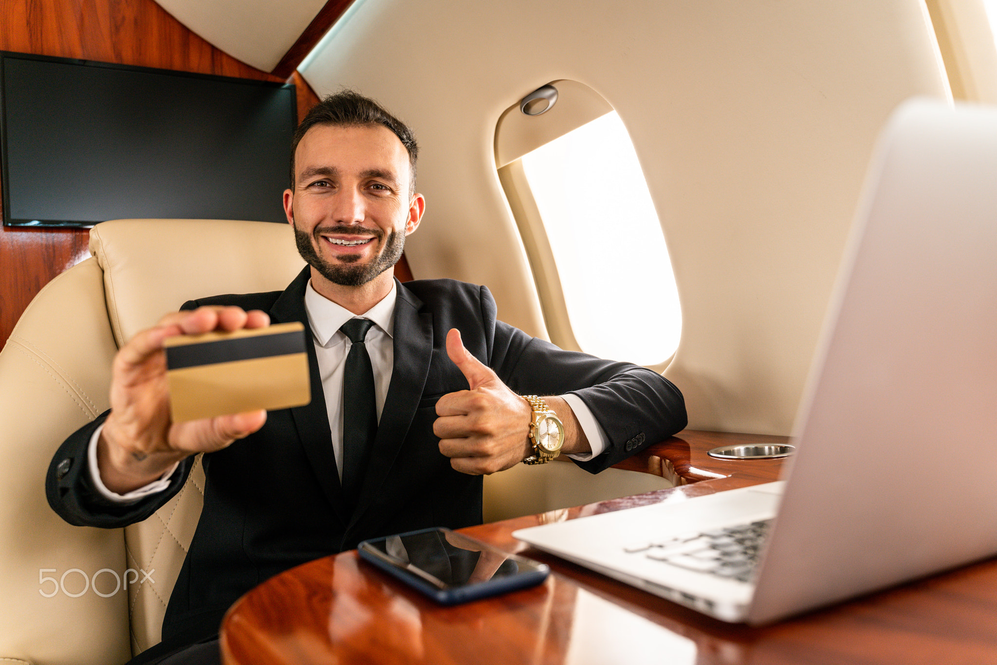 Businessman flying on private jet
