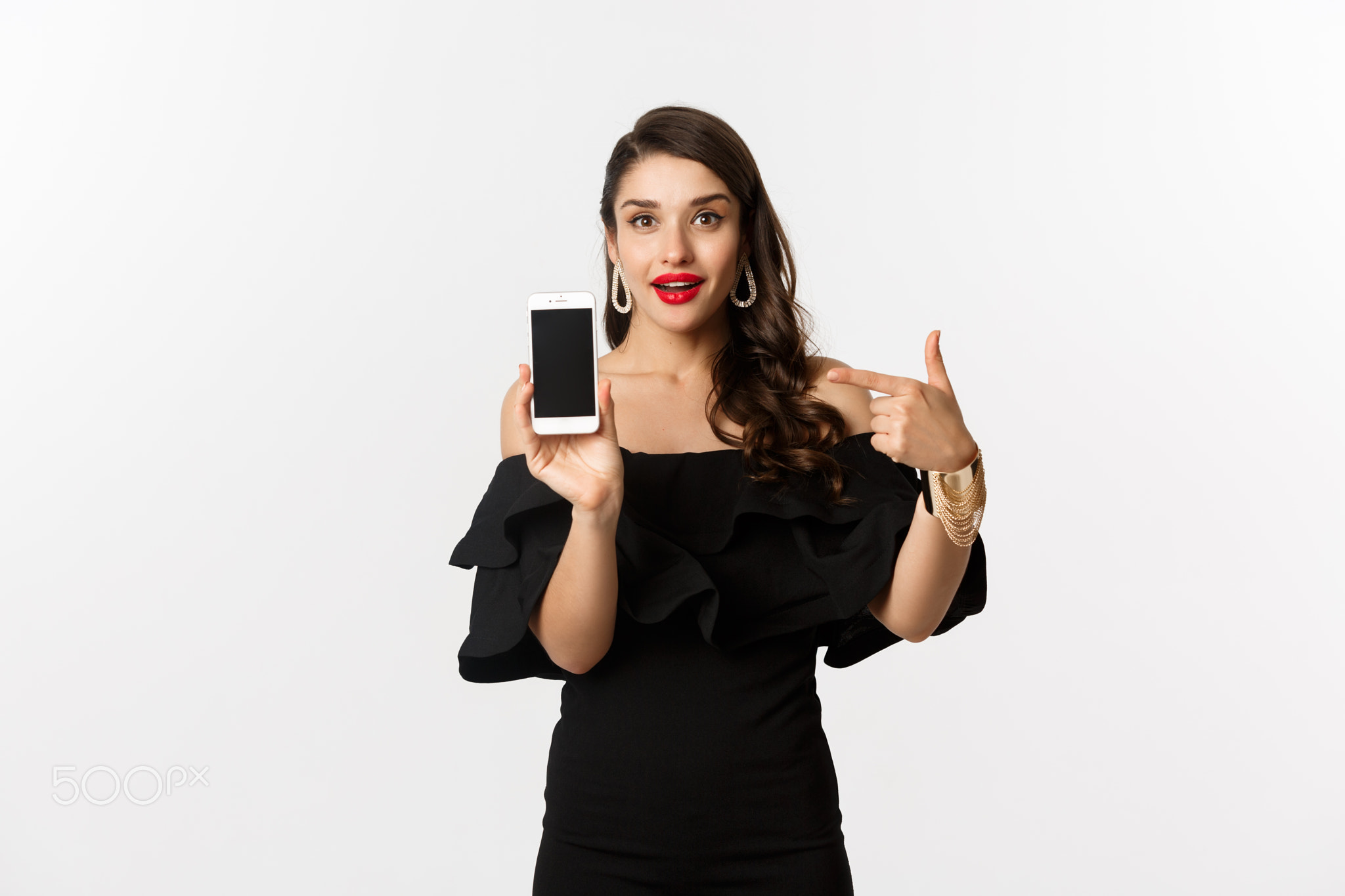 Online shopping concept. Fashionable woman in black dress pointing