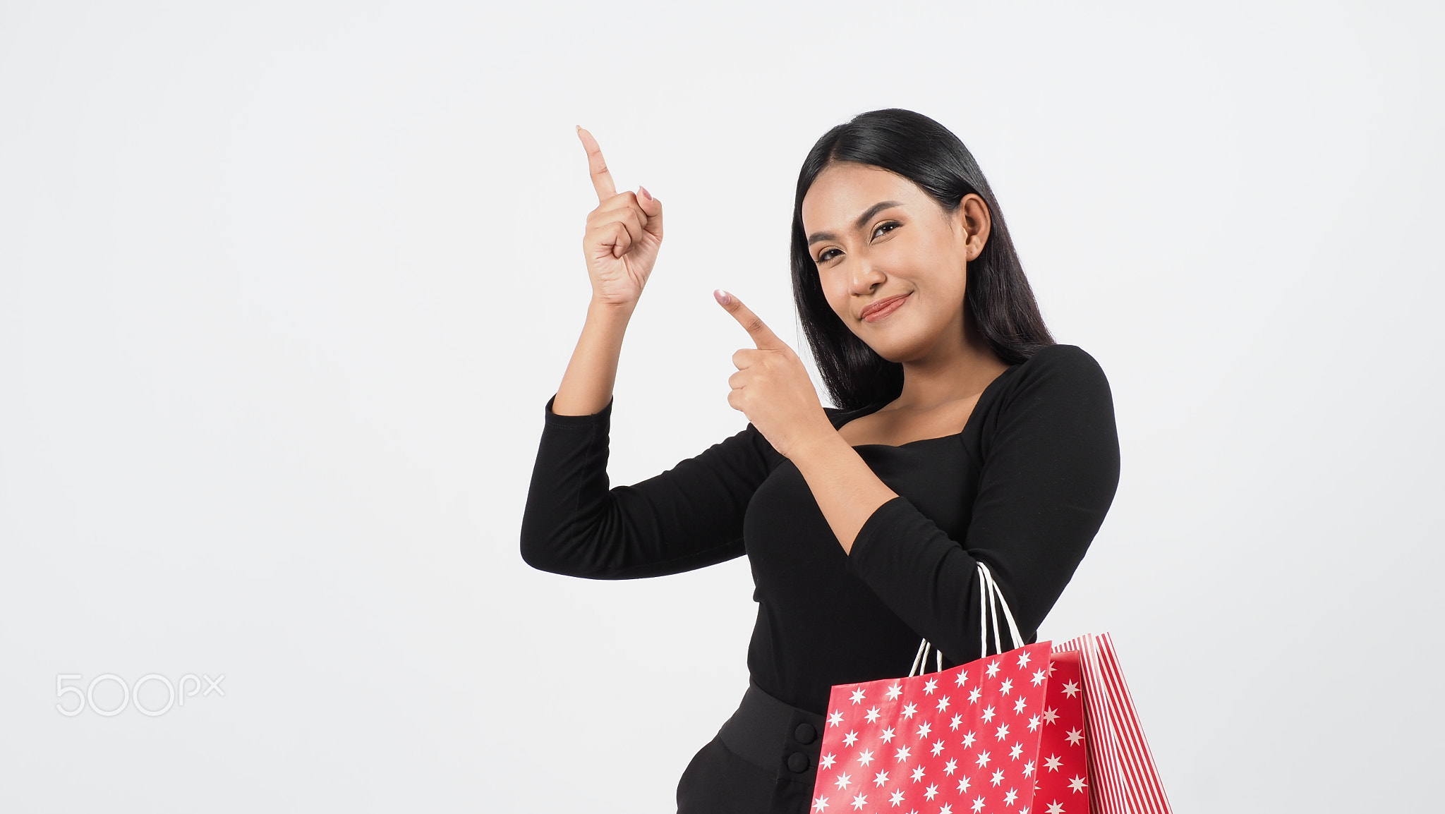 Sexy woman shopping. Portrait of beautiful girl holding shopping bags