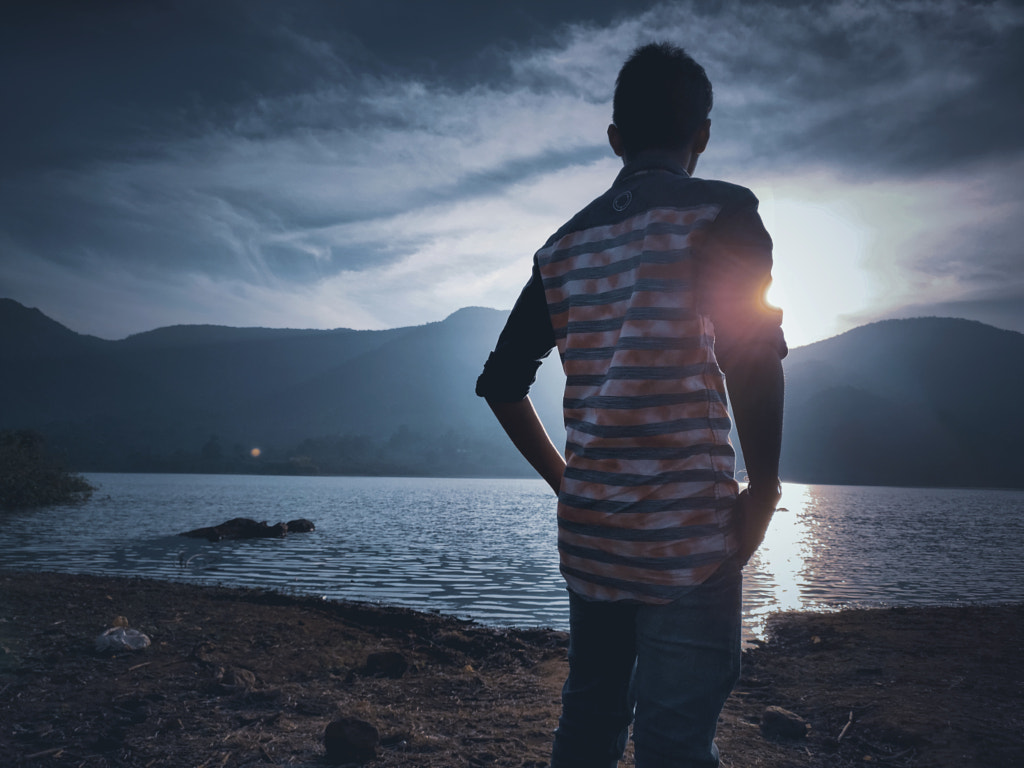 Wallpaper photograph A boy / men / human facing the sunlight at the evening near the lake Admiring the beauty of sunset by captured Jayashankar Majhi on 500px.com