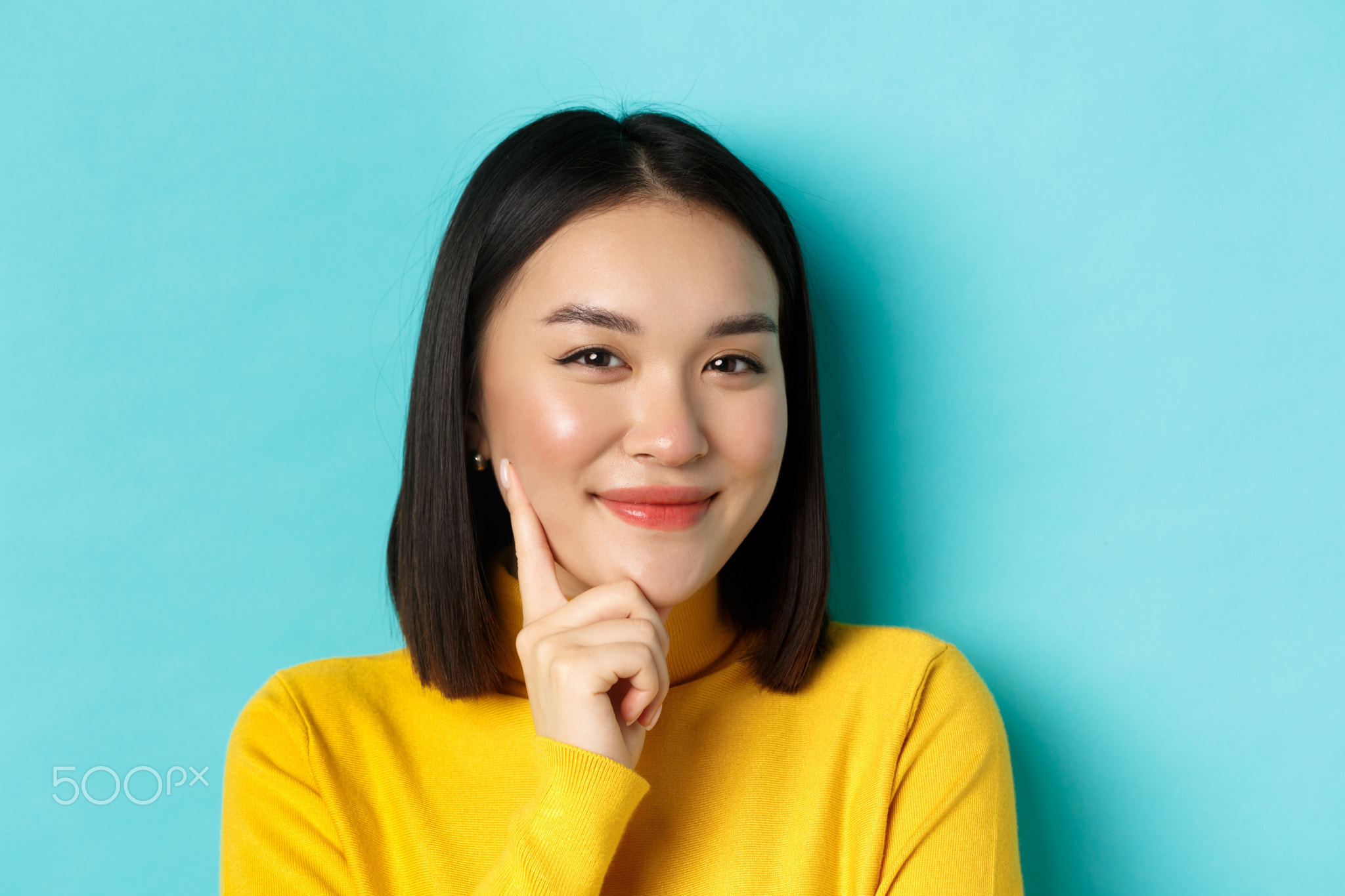 Beauty and makeup concept. Close up of thoughtful asian woman looking