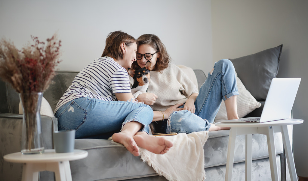 Beautiful lesbian family with dog at home by Olesya Kuznetsova on 500px.com