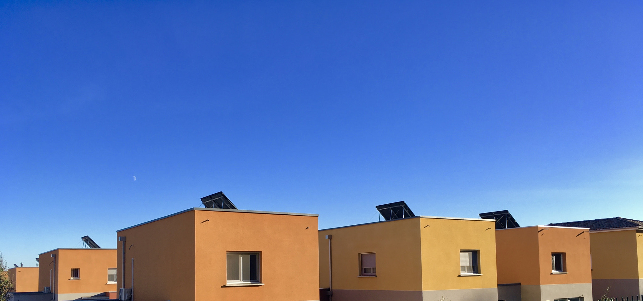 Orange houses against blue sky