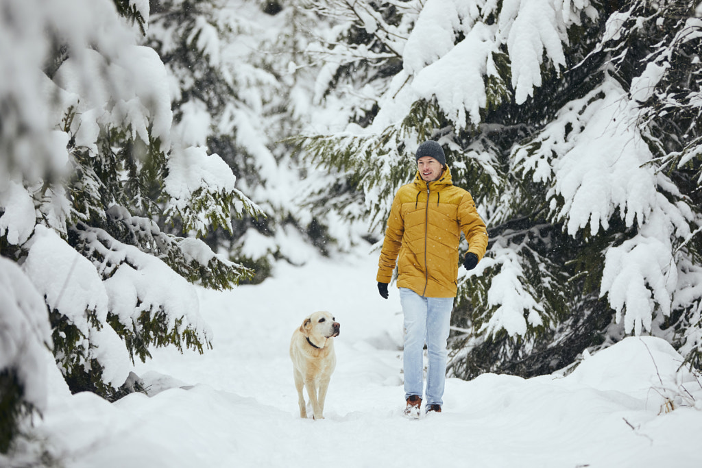 Front view of man with dog in winter nature by Jaromír Chalabala on 500px.com
