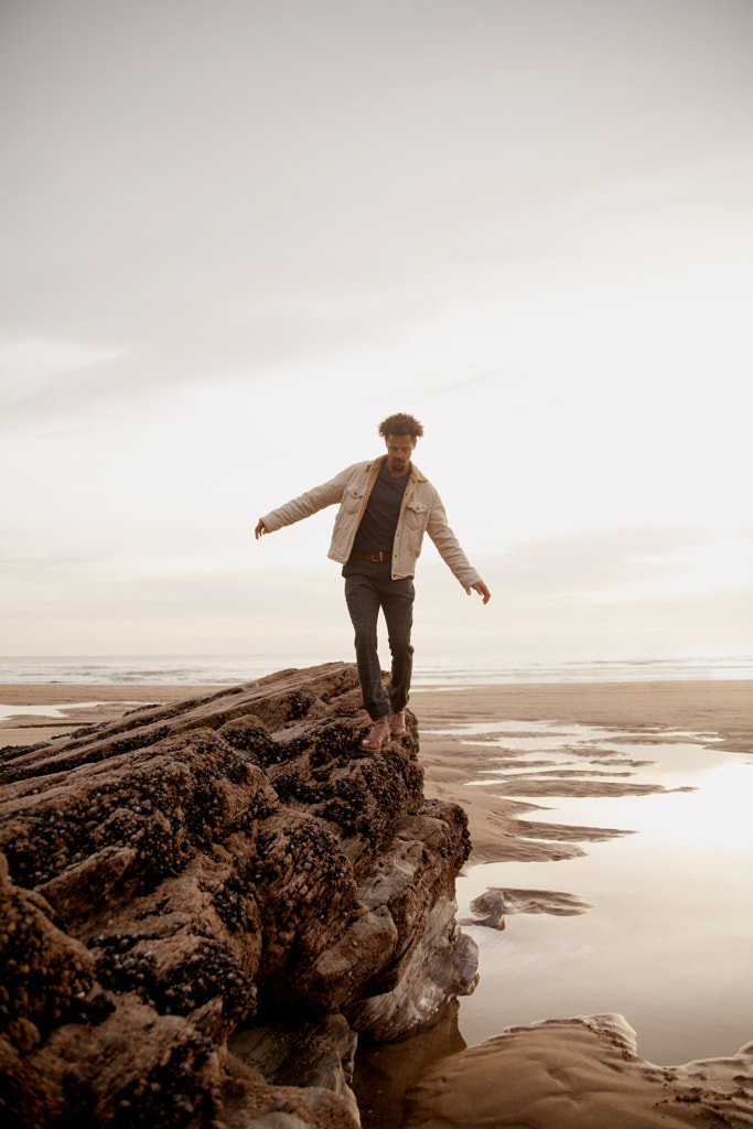 Portrait of young biracial man at the beach by Anna Neubauer on 500px.com