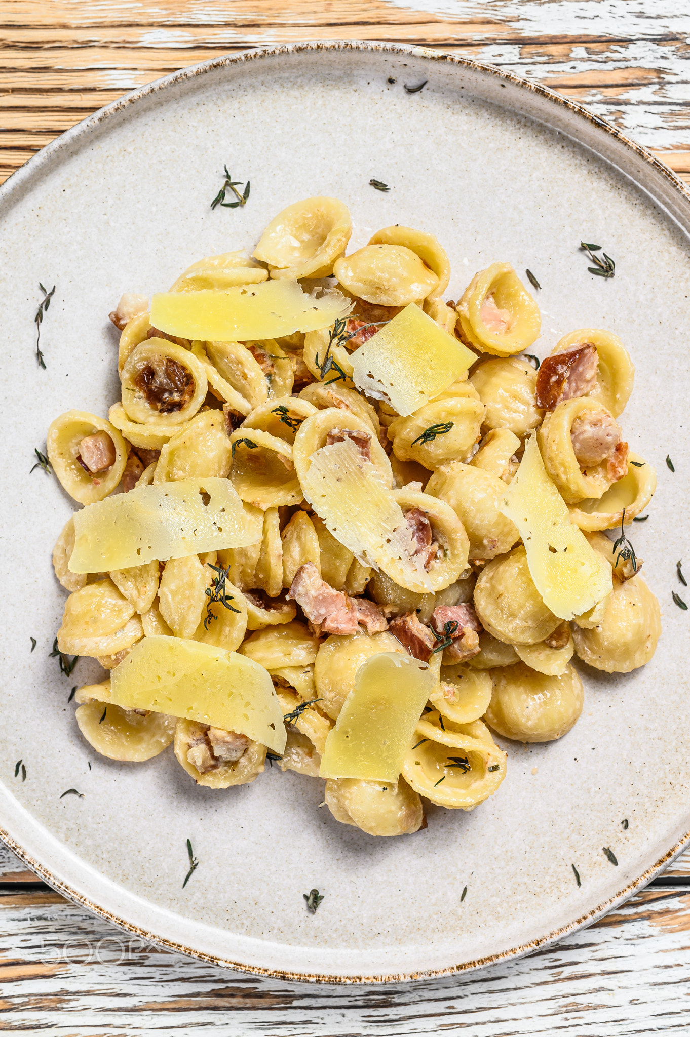 Orecchiette pasta with pancetta, egg, hard parmesan cheese and cream