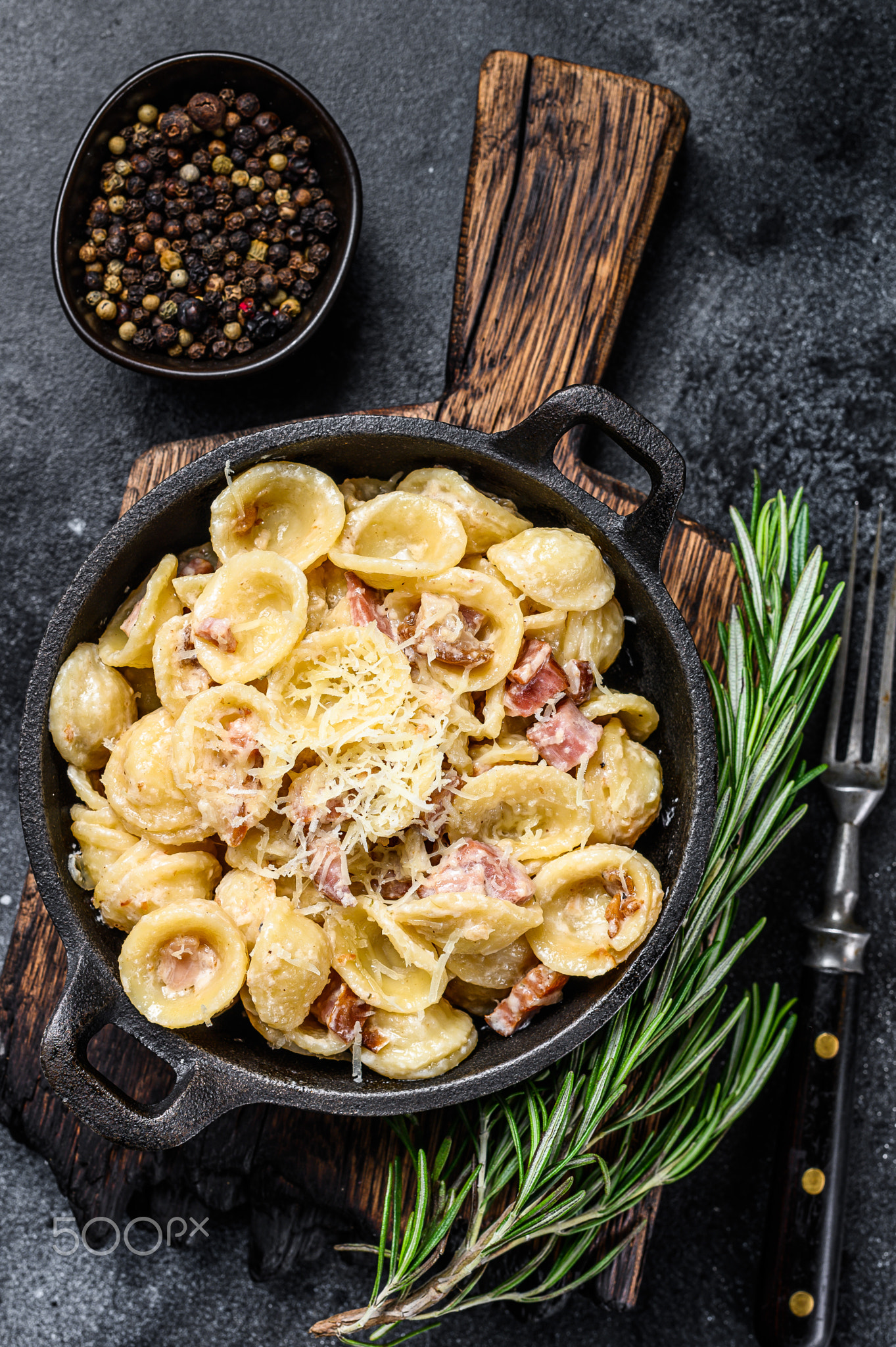 Orecchiette homemade carbonara pasta with pancetta, egg, hard parmesan