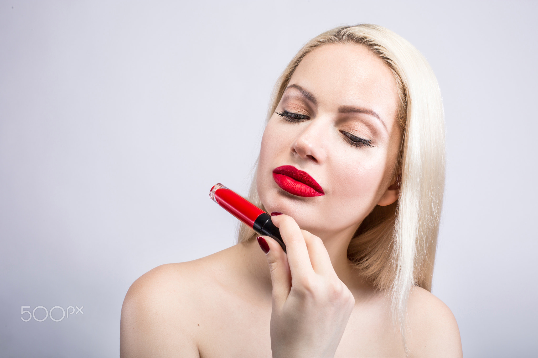 Portrait of Beautiful Woman a blonde With Red Lipstick