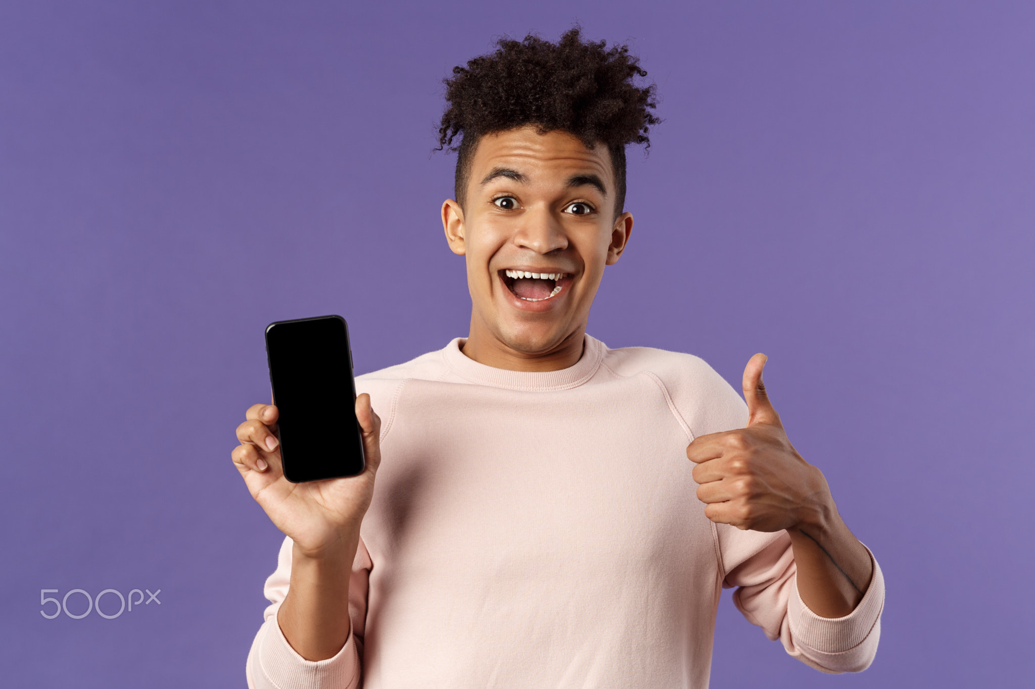Happy young man, hispanic guy with dreads recommend app, online