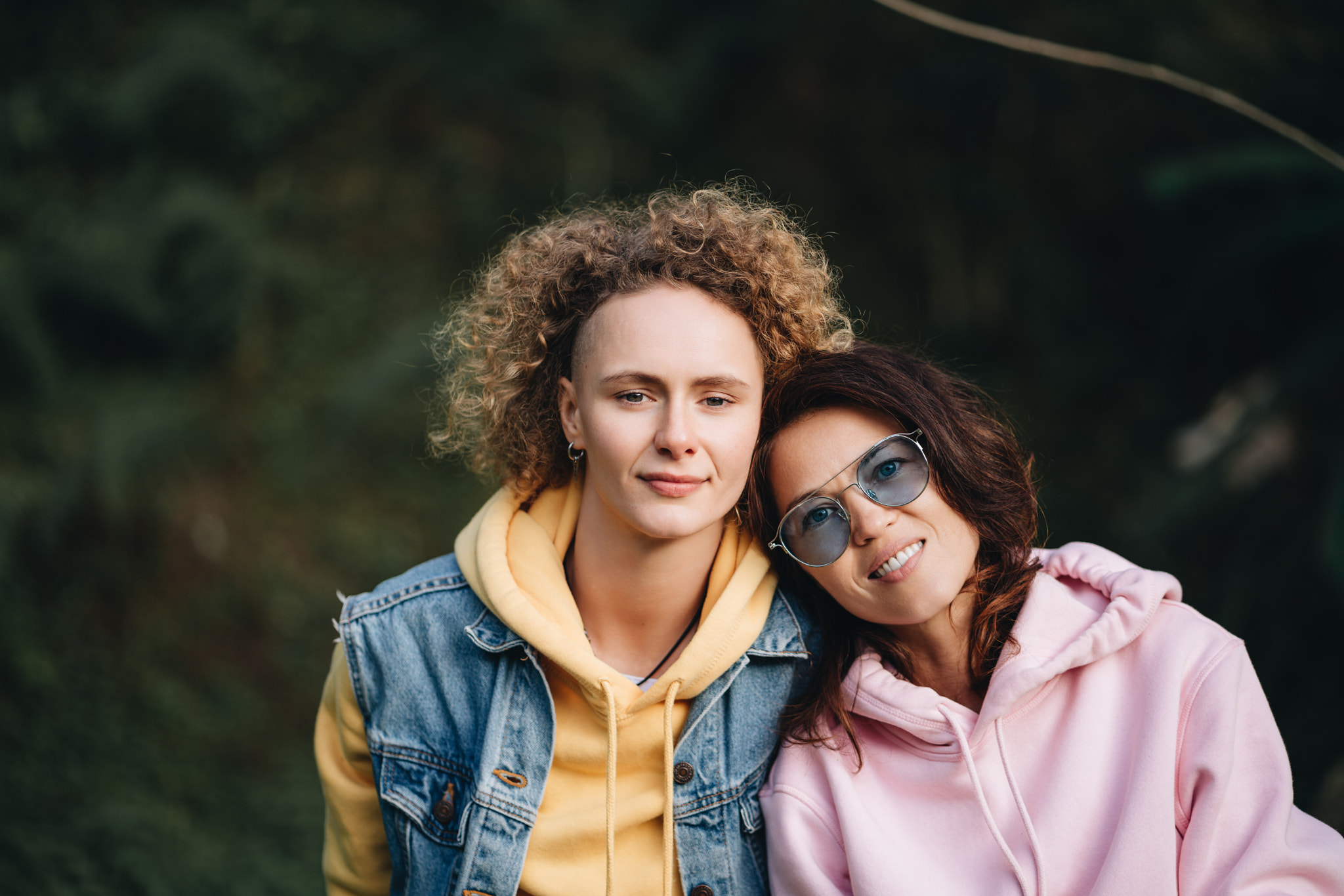 Lesbian couple sitting together in a park