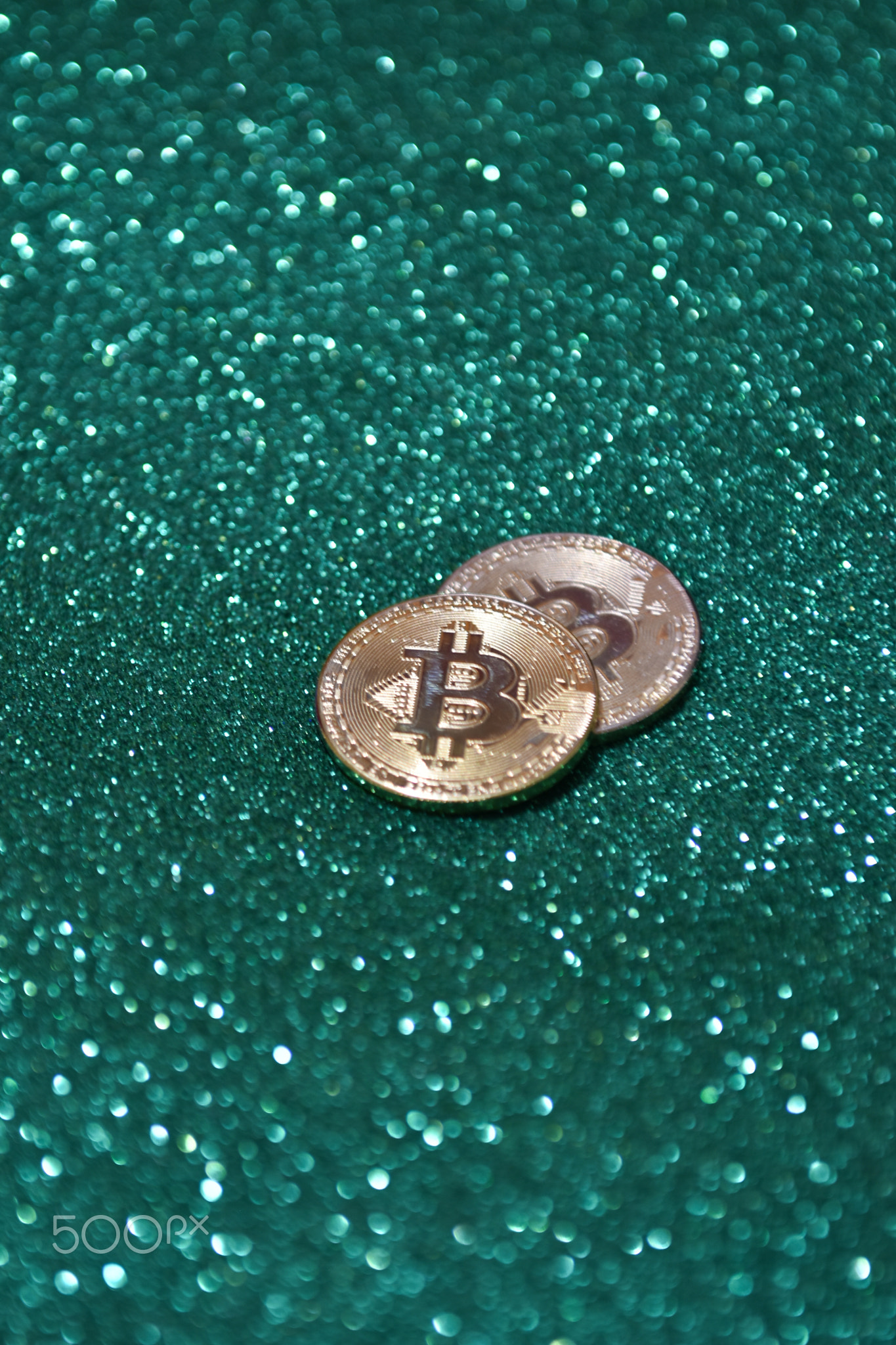 Golden bitcoin coin with glitter lights background