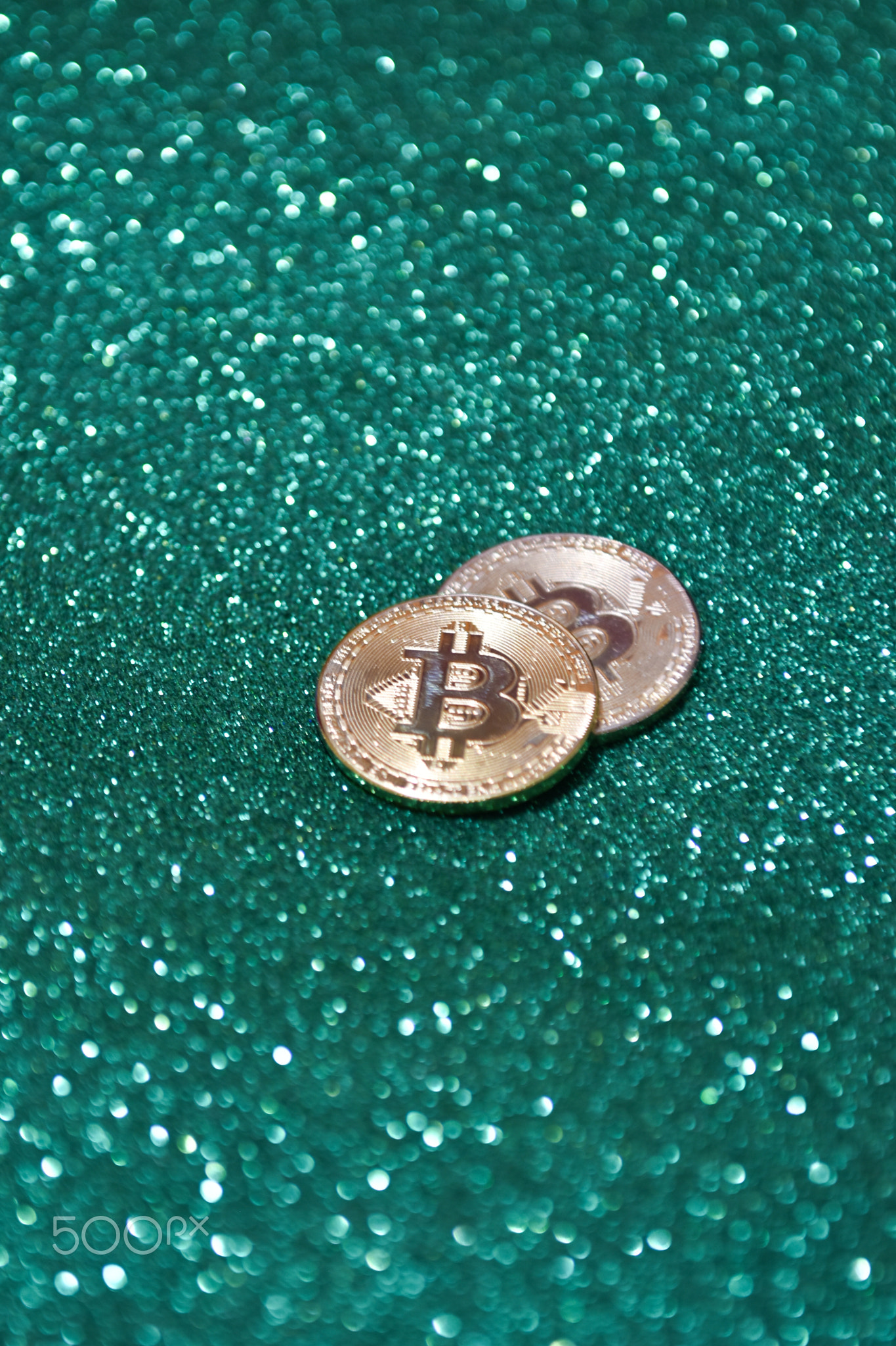 Golden bitcoin coin with glitter lights background