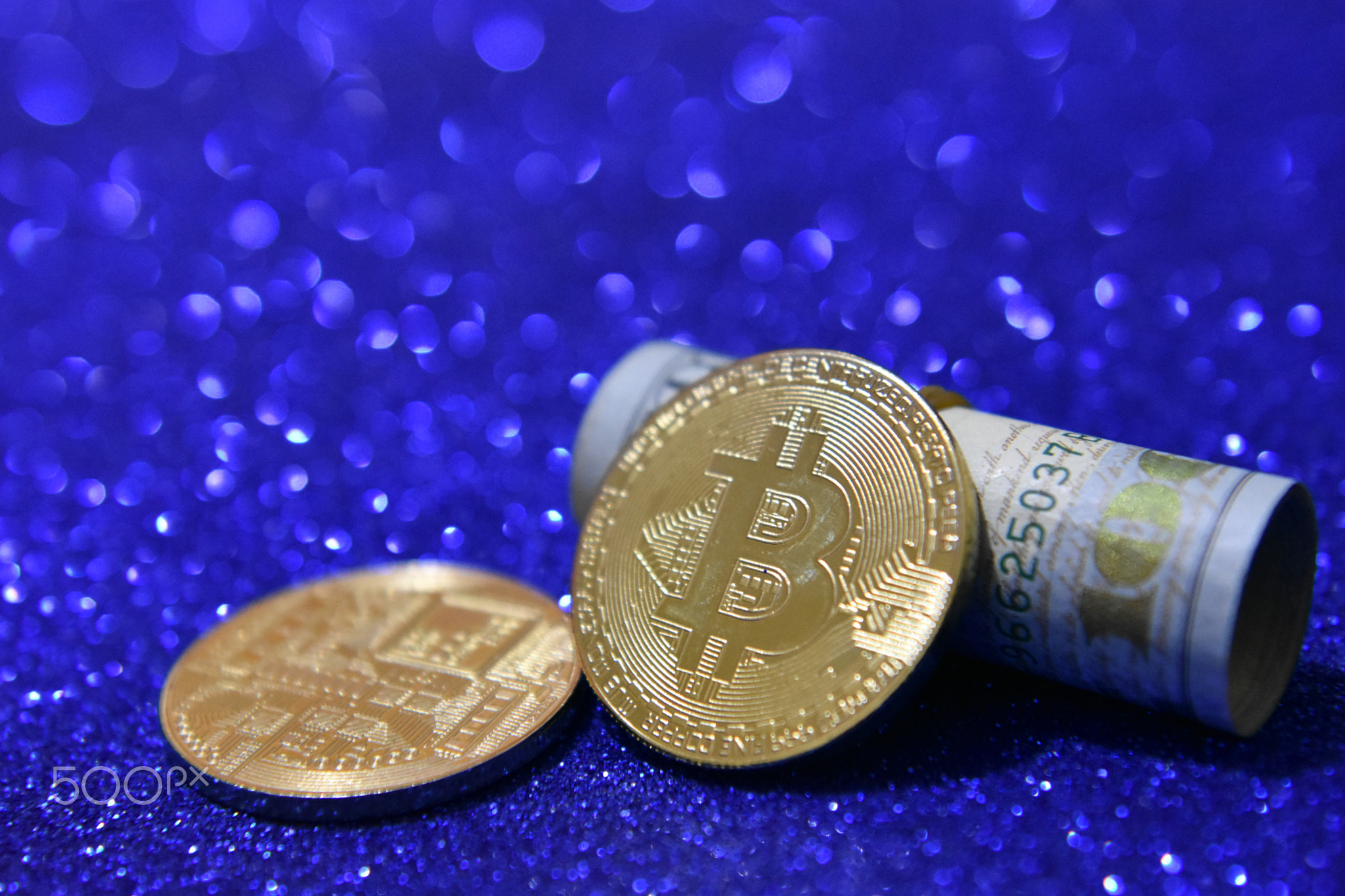 Golden bitcoin coins with glitter background, crypto currency concept.